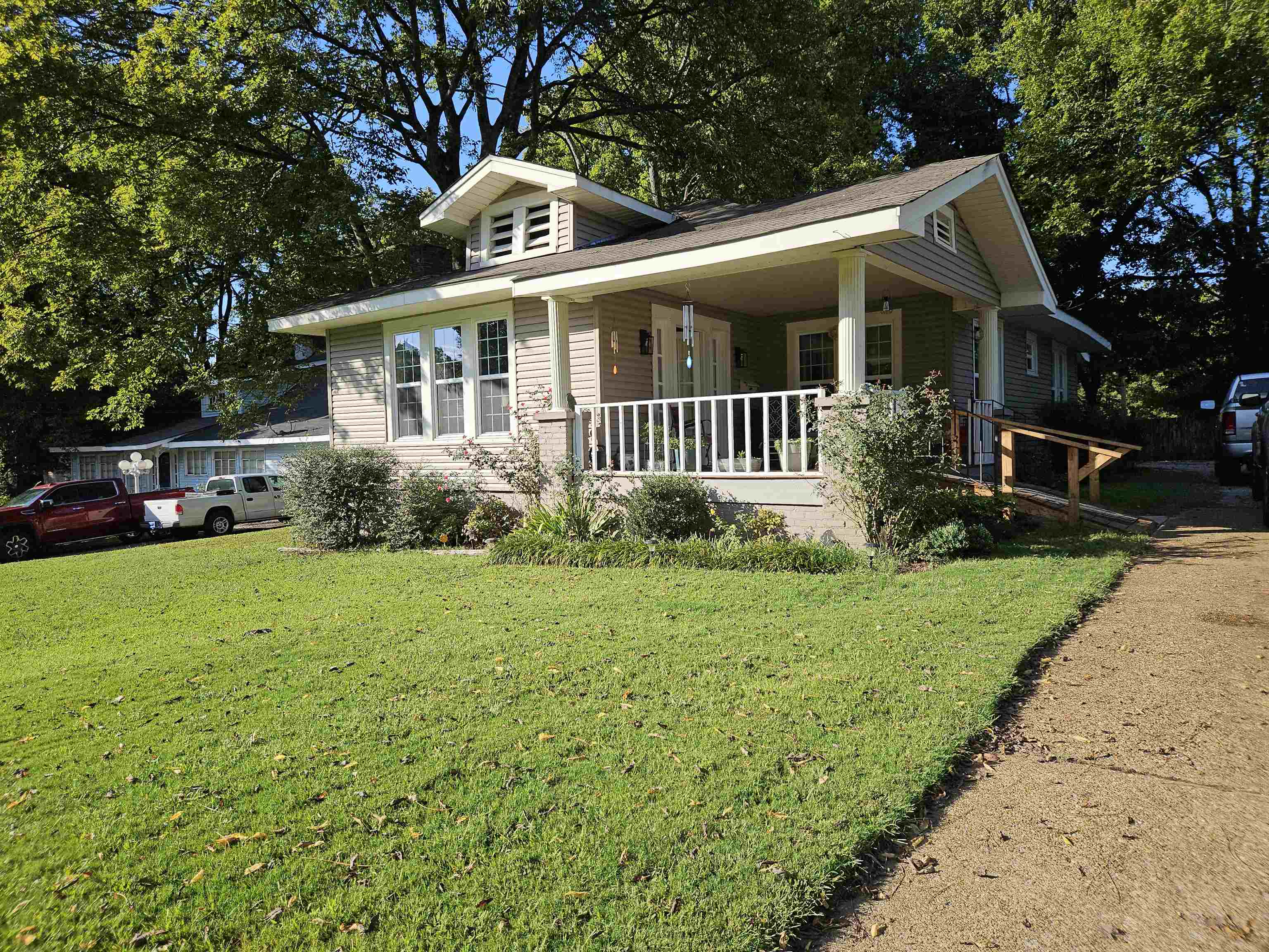 141 Tucker Avenue Ripley, TN 38063 - Photo 1 of 14 a front view of house with yard and green space
