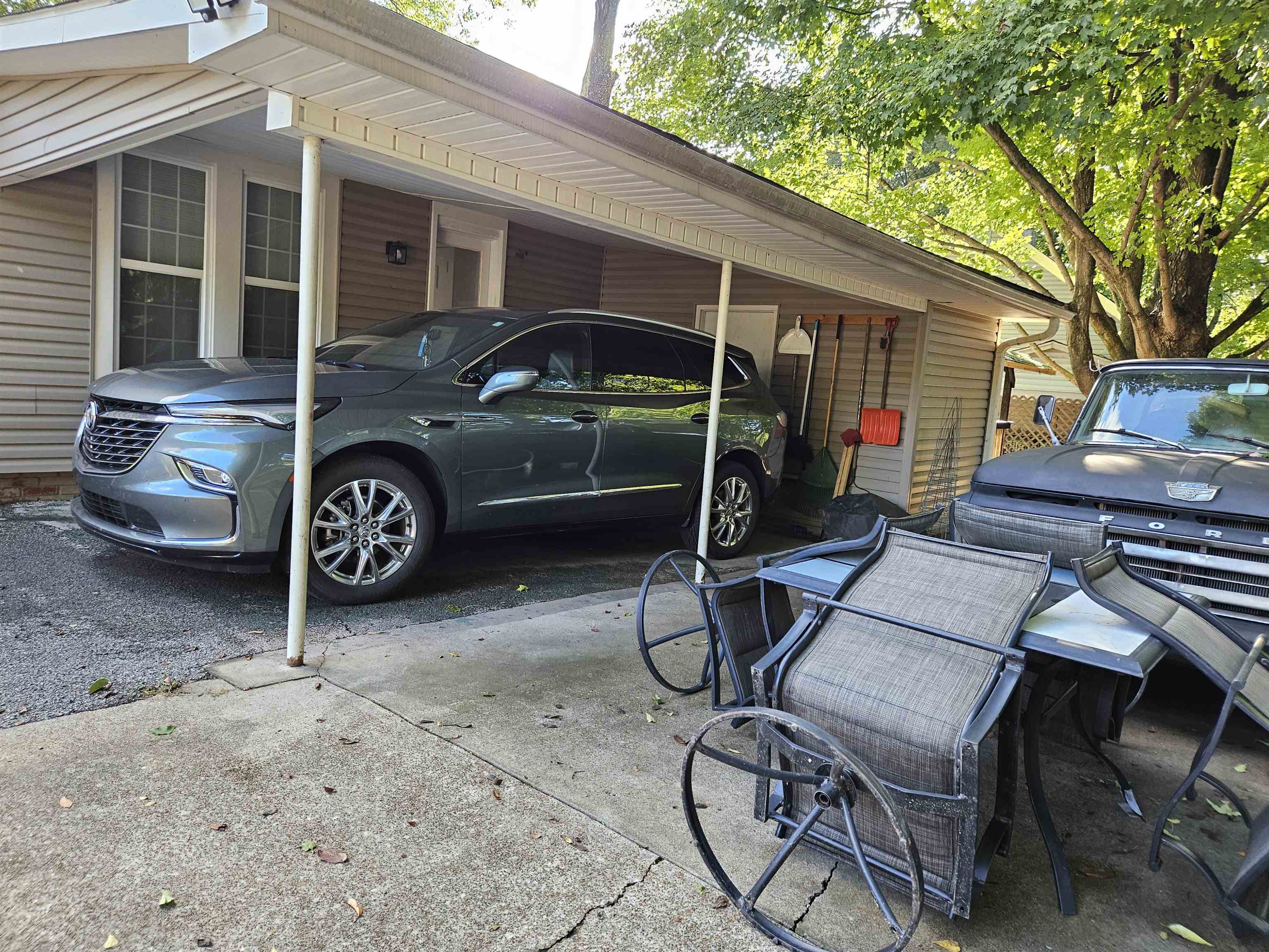 141 Tucker Avenue Ripley, TN 38063 - Photo 12 of 14 a view of a patio with table and chairs