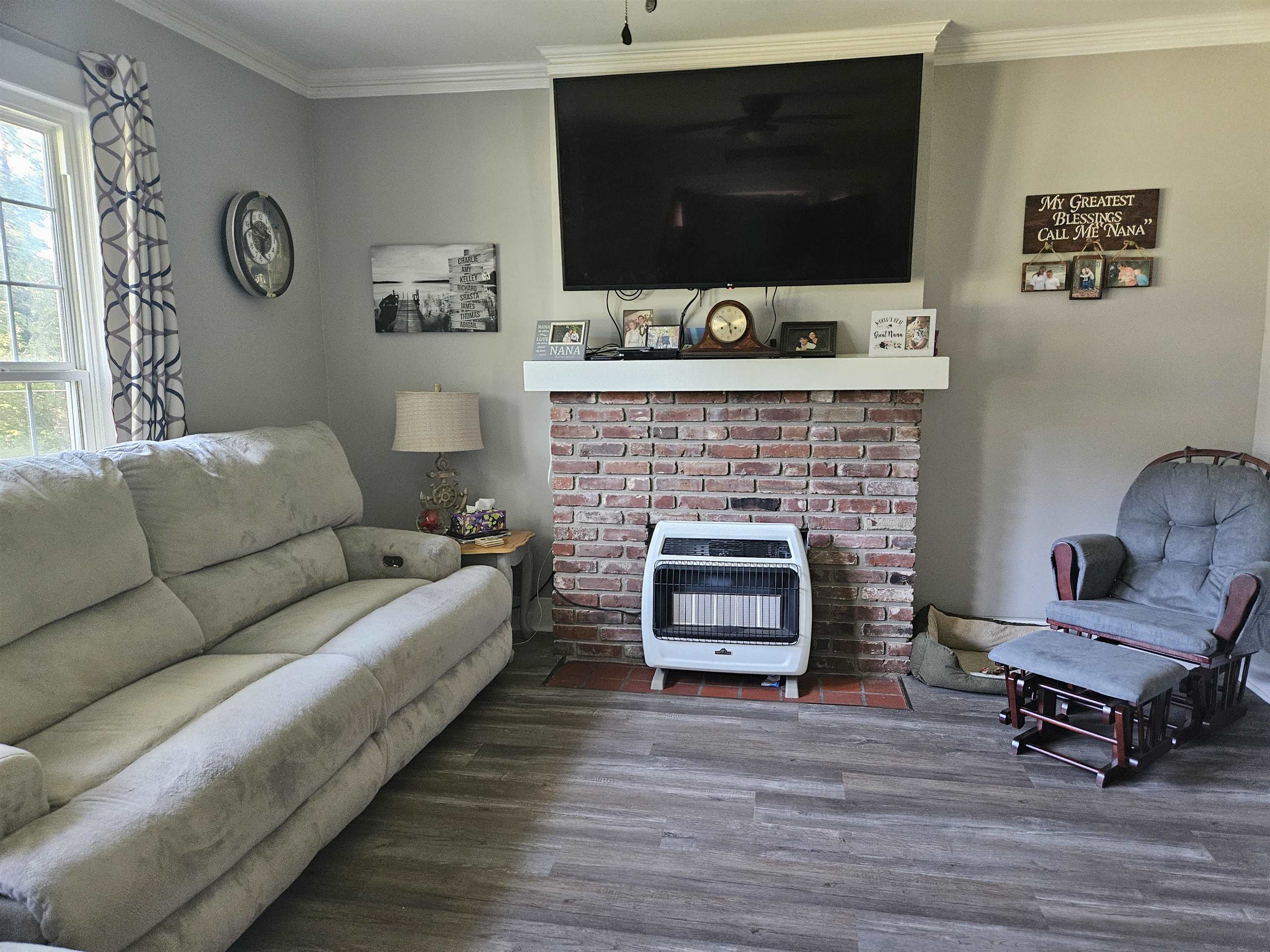 141 Tucker Avenue Ripley, TN 38063 - Photo 3 of 14 a living room with furniture and a flat screen tv