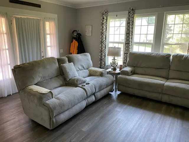 a living room with furniture and a window