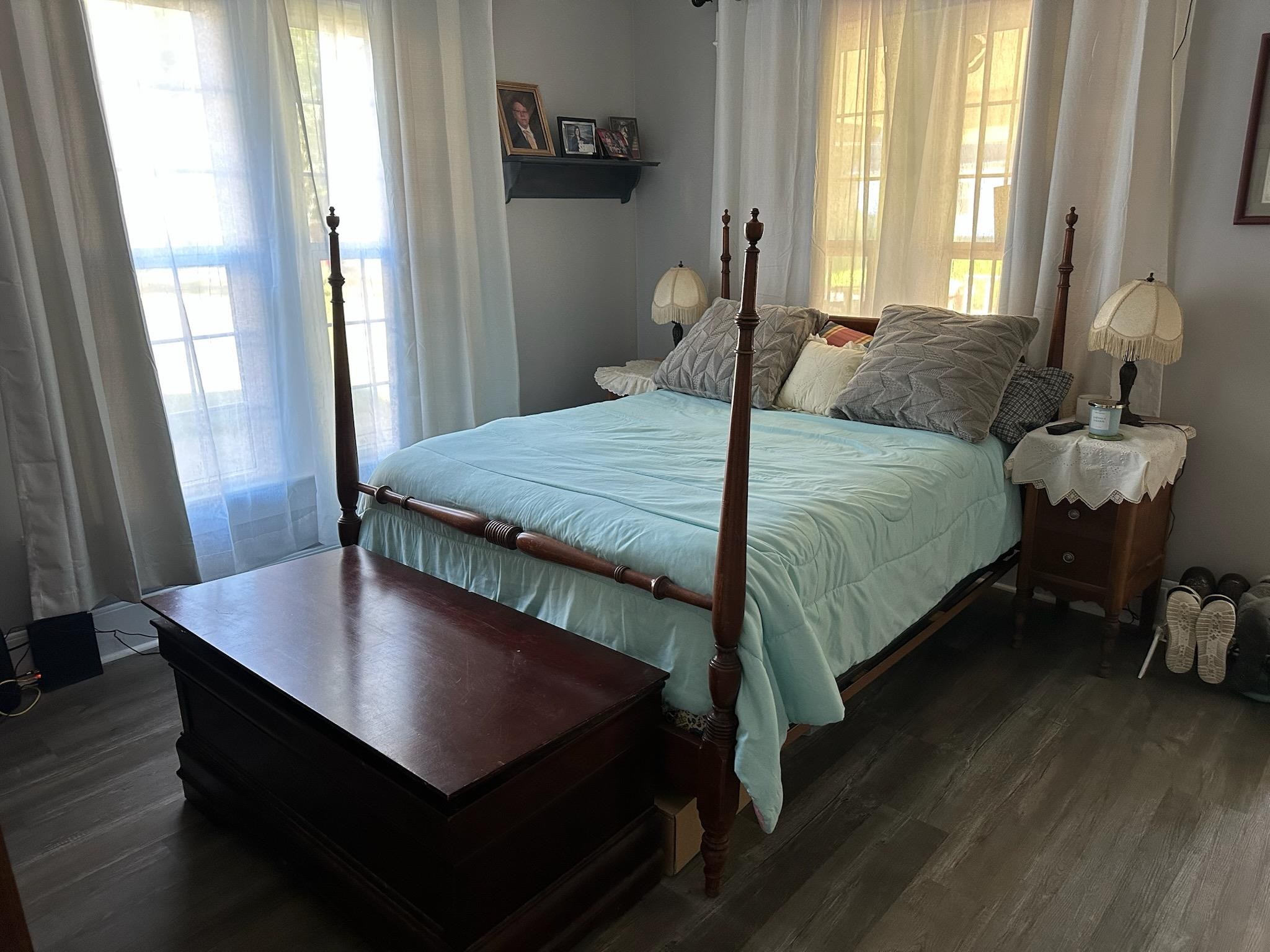 141 Tucker Avenue Ripley, TN 38063 - Photo 9 of 14 a bedroom with a bed and a table