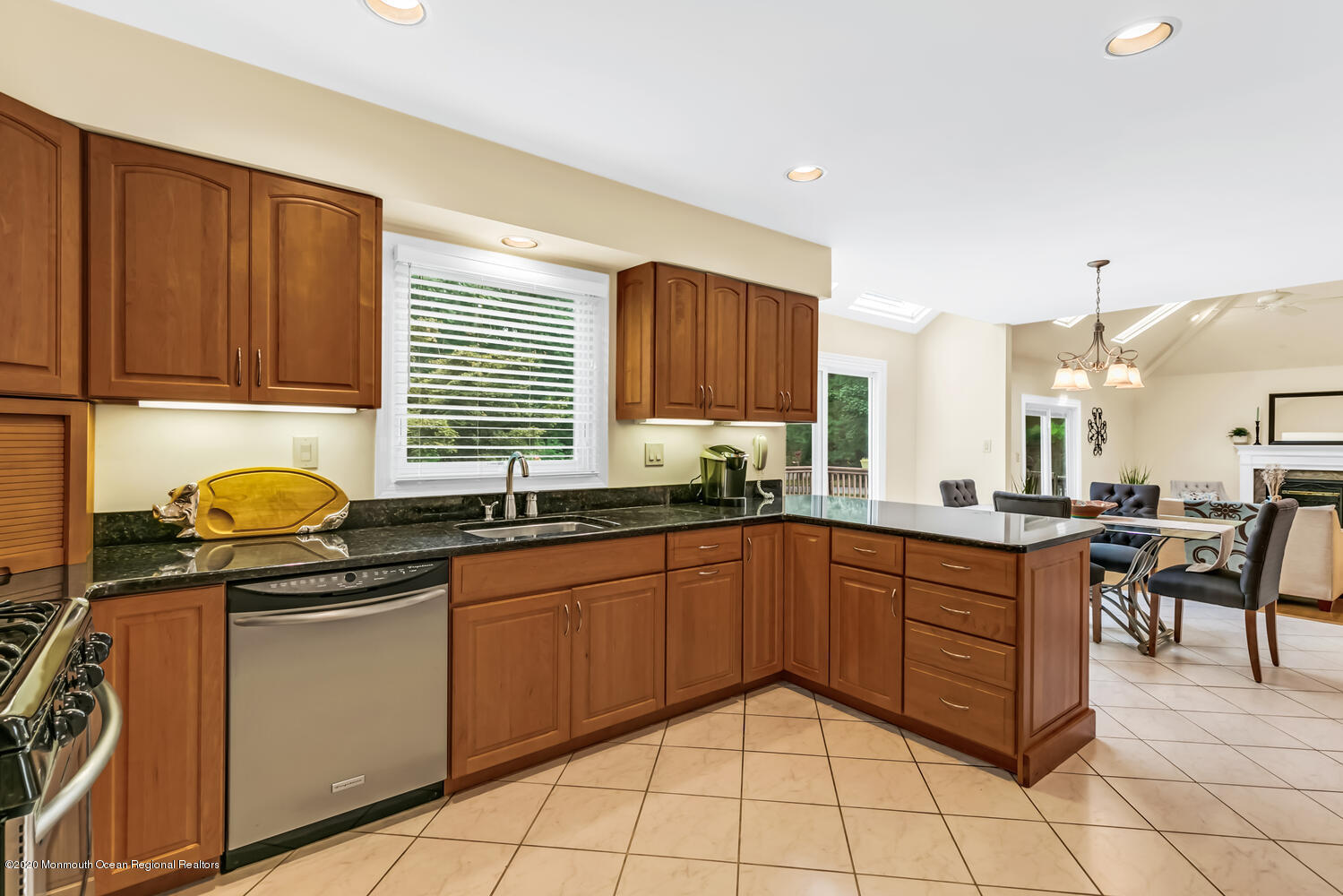 38 Knob Hill Road Morganville, NJ 07751 - Photo 13 of 35 a kitchen with a sink a stove and cabinets