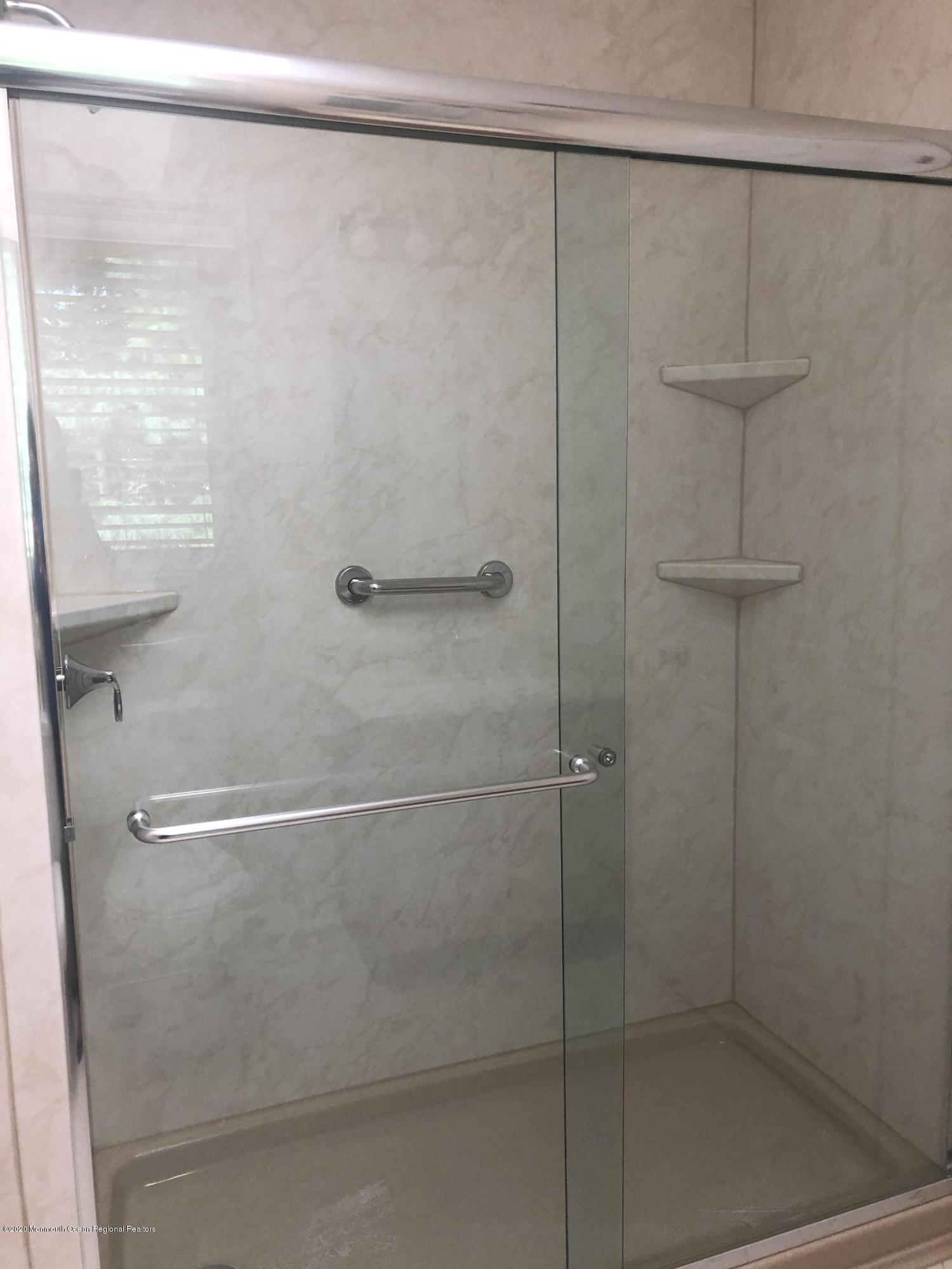 38 Knob Hill Road Morganville, NJ 07751 - Photo 22 of 35 a bathroom with a shower