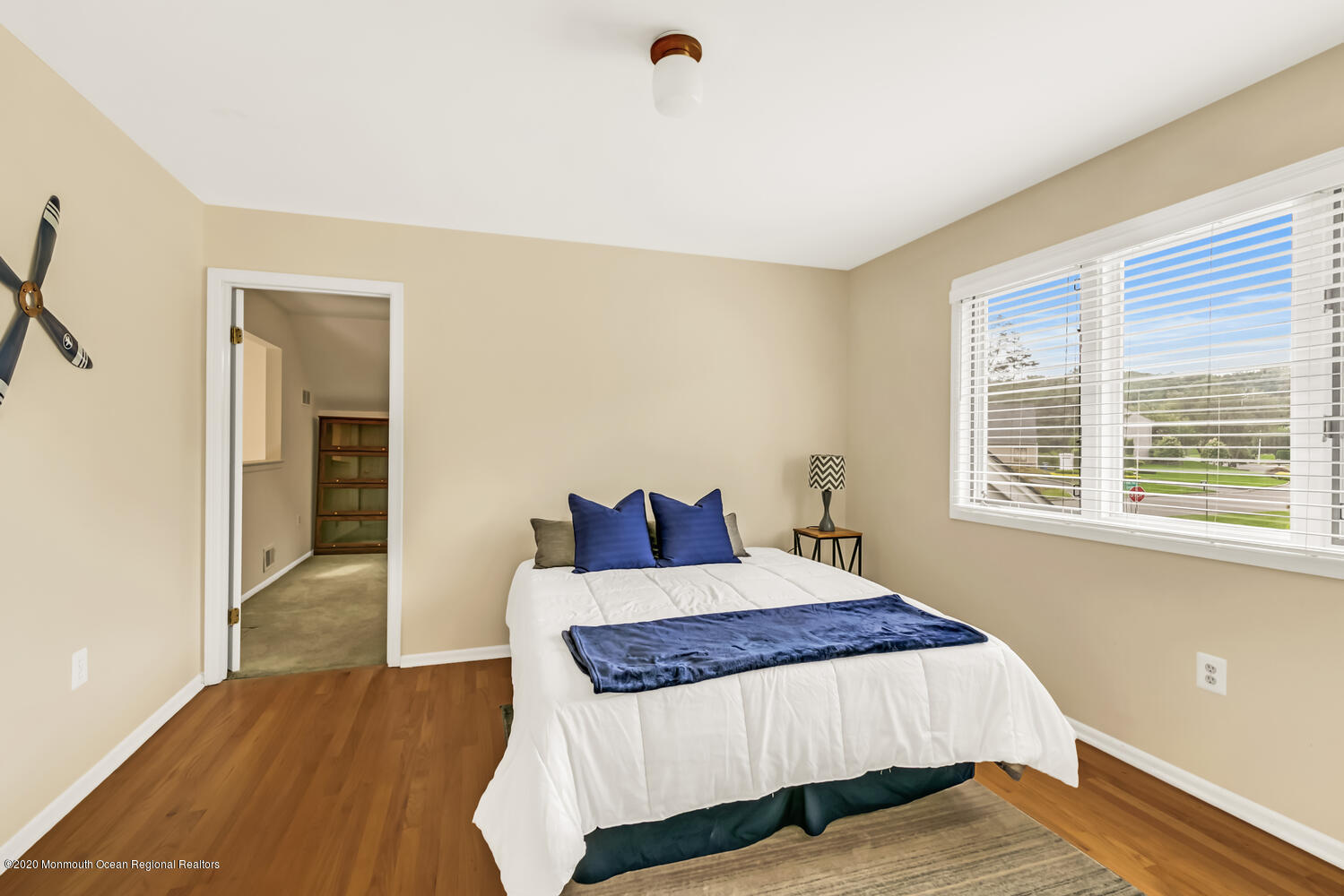 38 Knob Hill Road Morganville, NJ 07751 - Photo 23 of 35 a bedroom with a bed and wooden floor