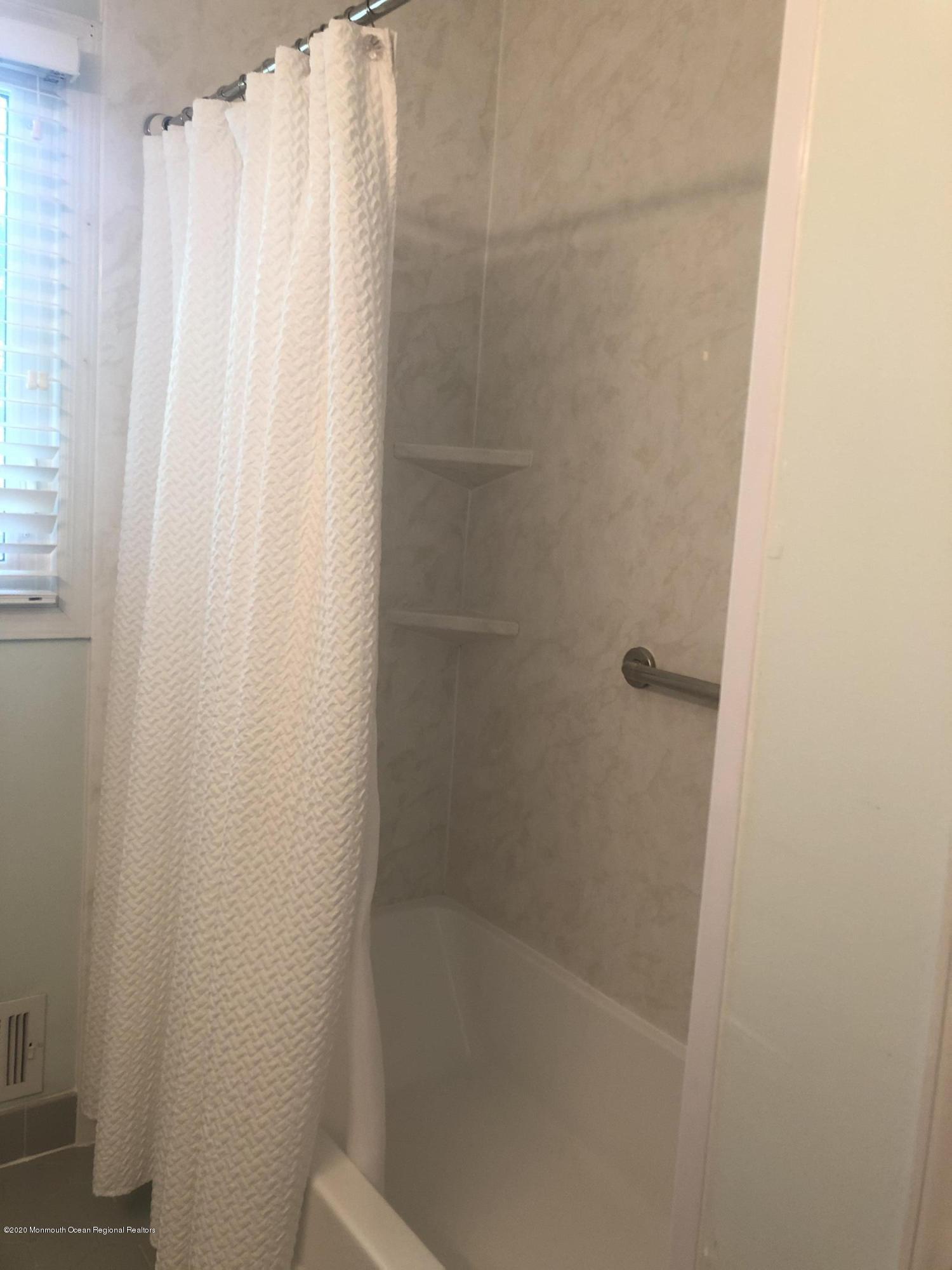 38 Knob Hill Road Morganville, NJ 07751 - Photo 28 of 35 a close up of a shower curtain