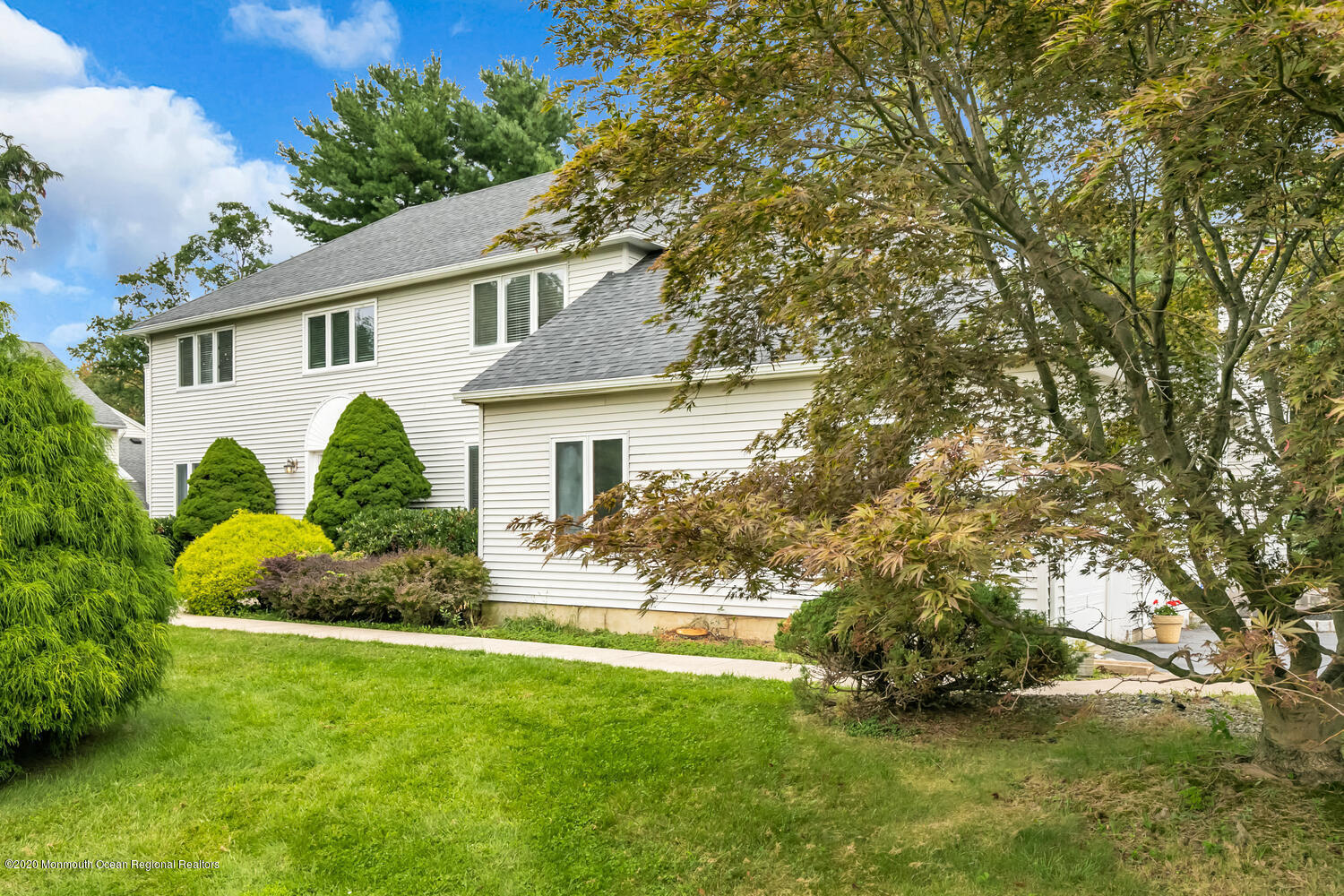 38 Knob Hill Road Morganville, NJ 07751 - Photo 33 of 35 a view of a house with a yard and plants