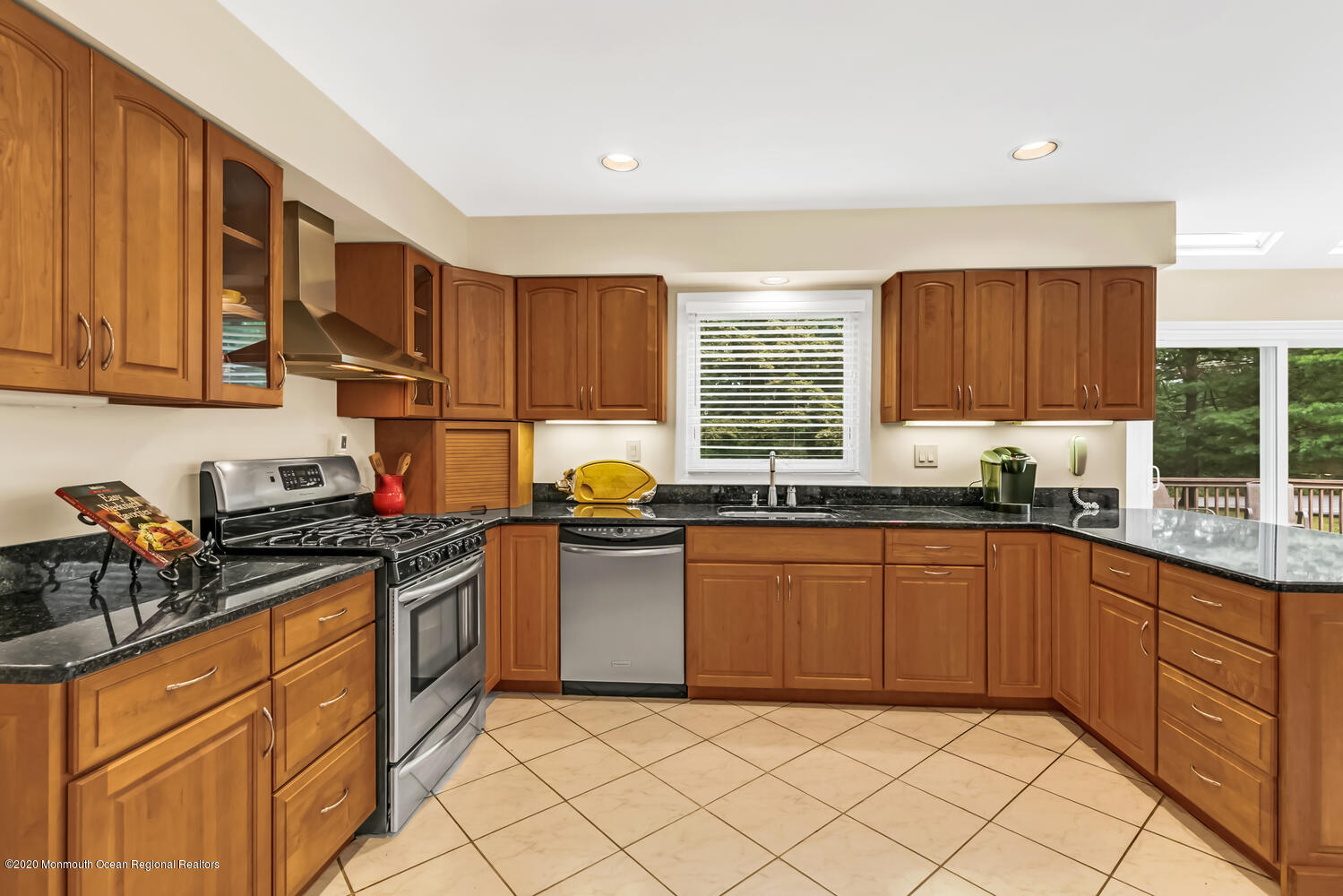 38 Knob Hill Road Morganville, NJ 07751 - Photo 8 of 35 a kitchen with stainless steel appliances granite countertop wooden cabinets a sink and dishwasher