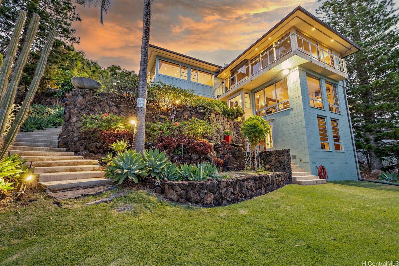 a front view of a house with garden