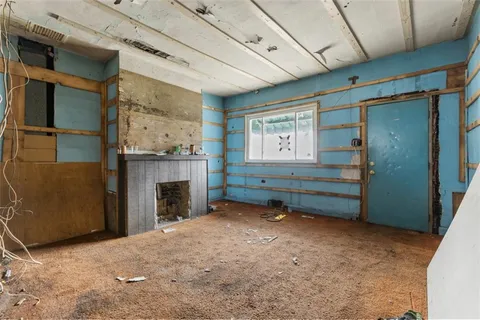 a room with fireplace and a window