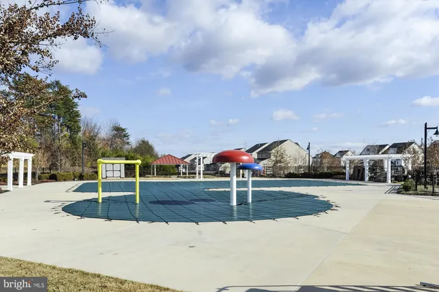 a view of a park with swings and slides