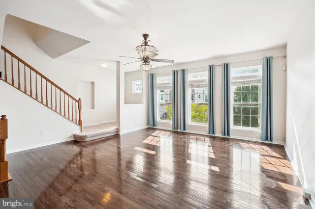 a view of an entryway with wooden floor