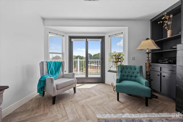 a view of a large garden with plants and large trees