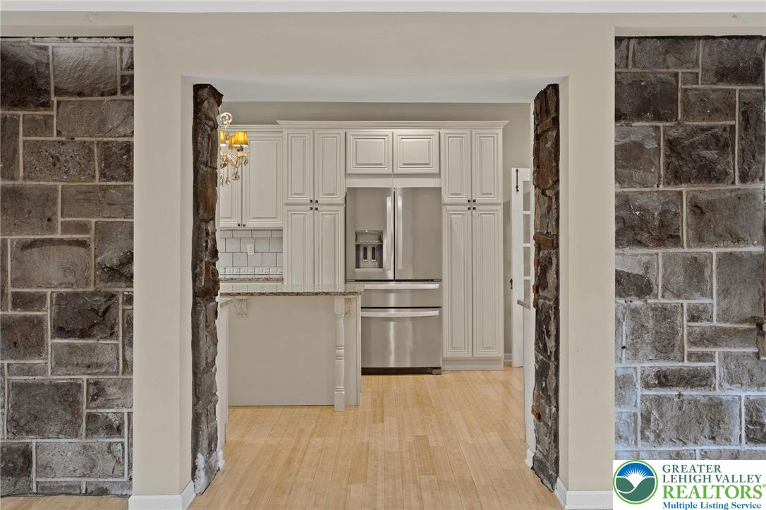 1790 Friedensville Road Bethlehem, PA 18015 - Photo 11 of 50 a kitchen with a refrigerator and cabinets