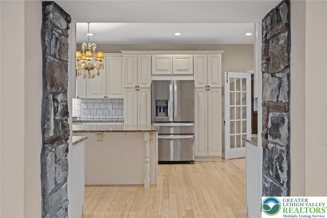 1790 Friedensville Road Bethlehem, PA 18015 - Photo 13 of 50 a kitchen with stainless steel appliances granite countertop a refrigerator and a sink