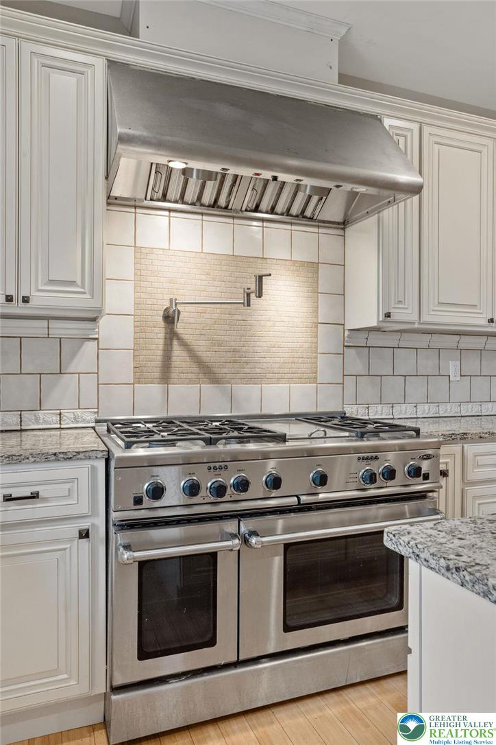 1790 Friedensville Road Bethlehem, PA 18015 - Photo 21 of 50 a stove top oven sitting inside of a kitchen