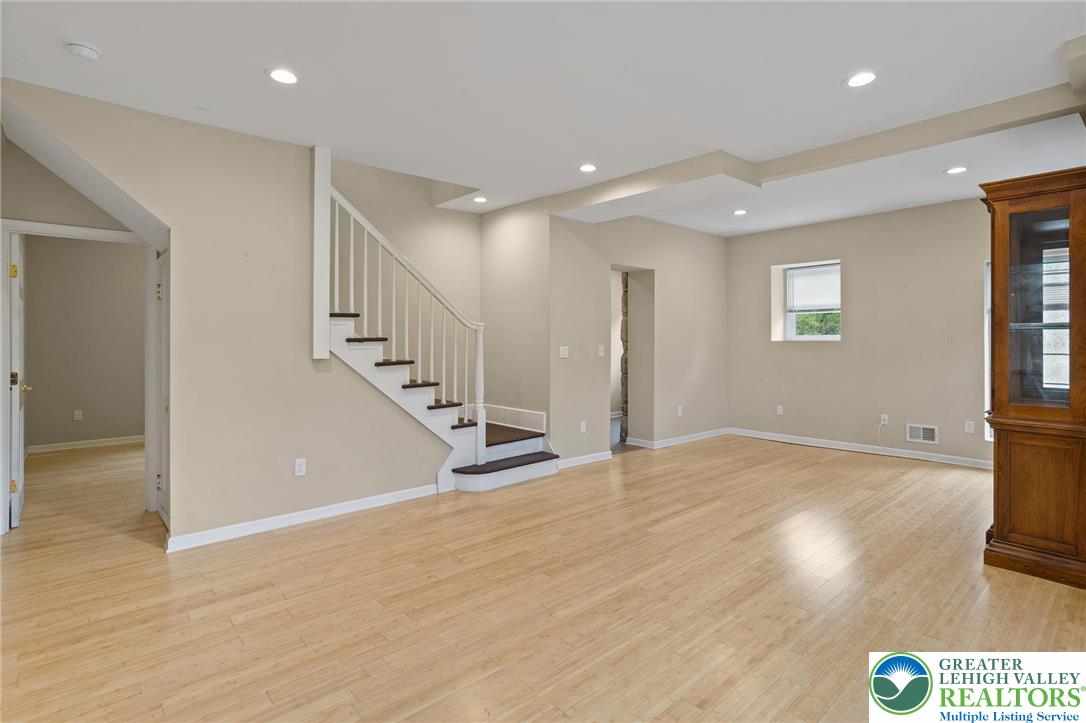 1790 Friedensville Road Bethlehem, PA 18015 - Photo 26 of 50 a view of an empty room with wooden floor and stairs
