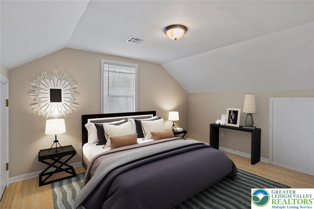 1790 Friedensville Road Bethlehem, PA 18015 - Photo 40 of 50 a bedroom with a bed and wooden floor