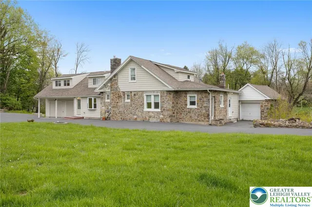 a front view of a house with a garden and porch