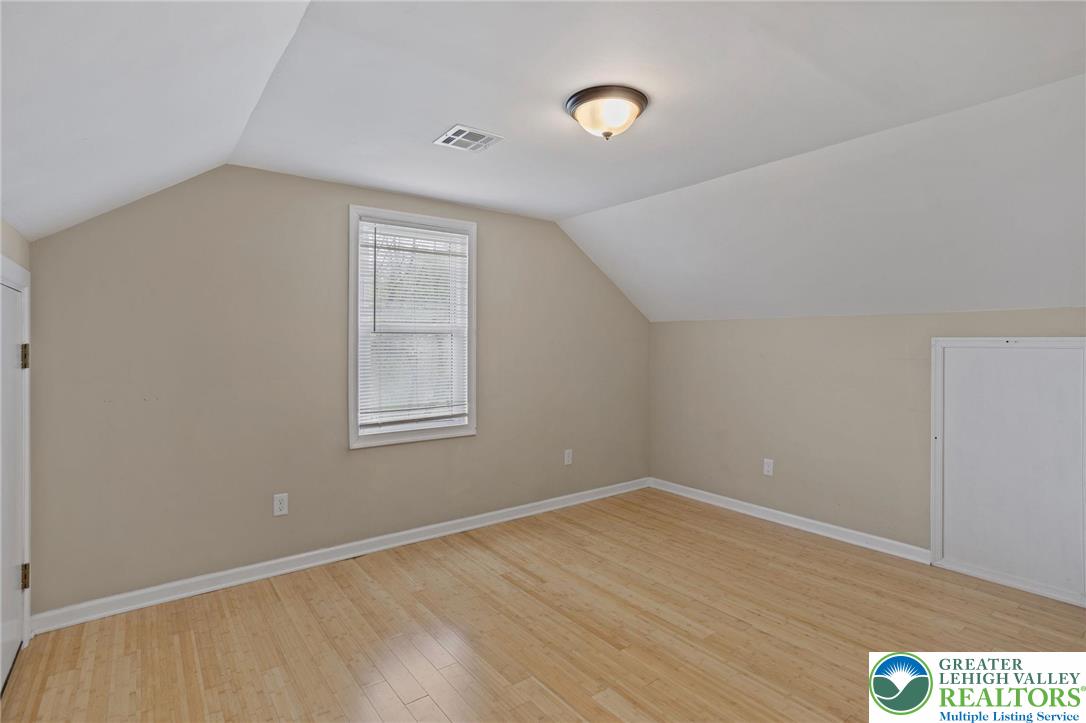 1790 Friedensville Road Bethlehem, PA 18015 - Photo 41 of 50 a view of an empty room with wooden floor and a window