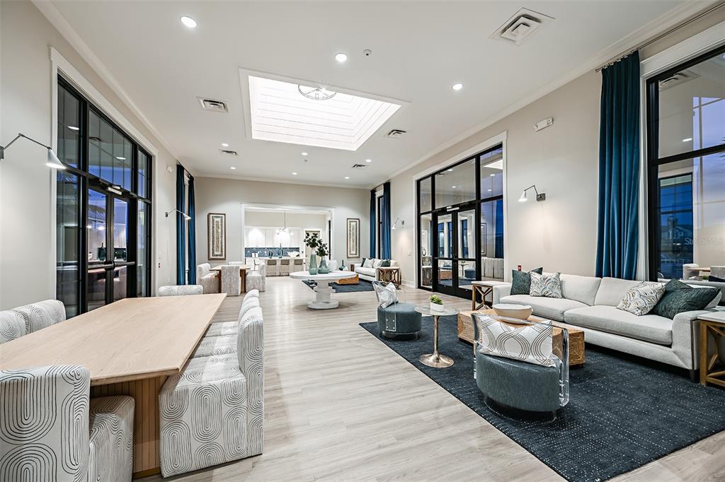 4711 Winsome Way Lakewood Ranch, FL 34211 - Photo 18 of 18 a living room with furniture wooden floor and a book shelf