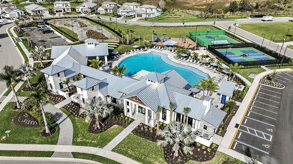 4711 Winsome Way Lakewood Ranch, FL 34211 - Photo 3 of 18 an aerial view of a house yard swimming pool and ocean view