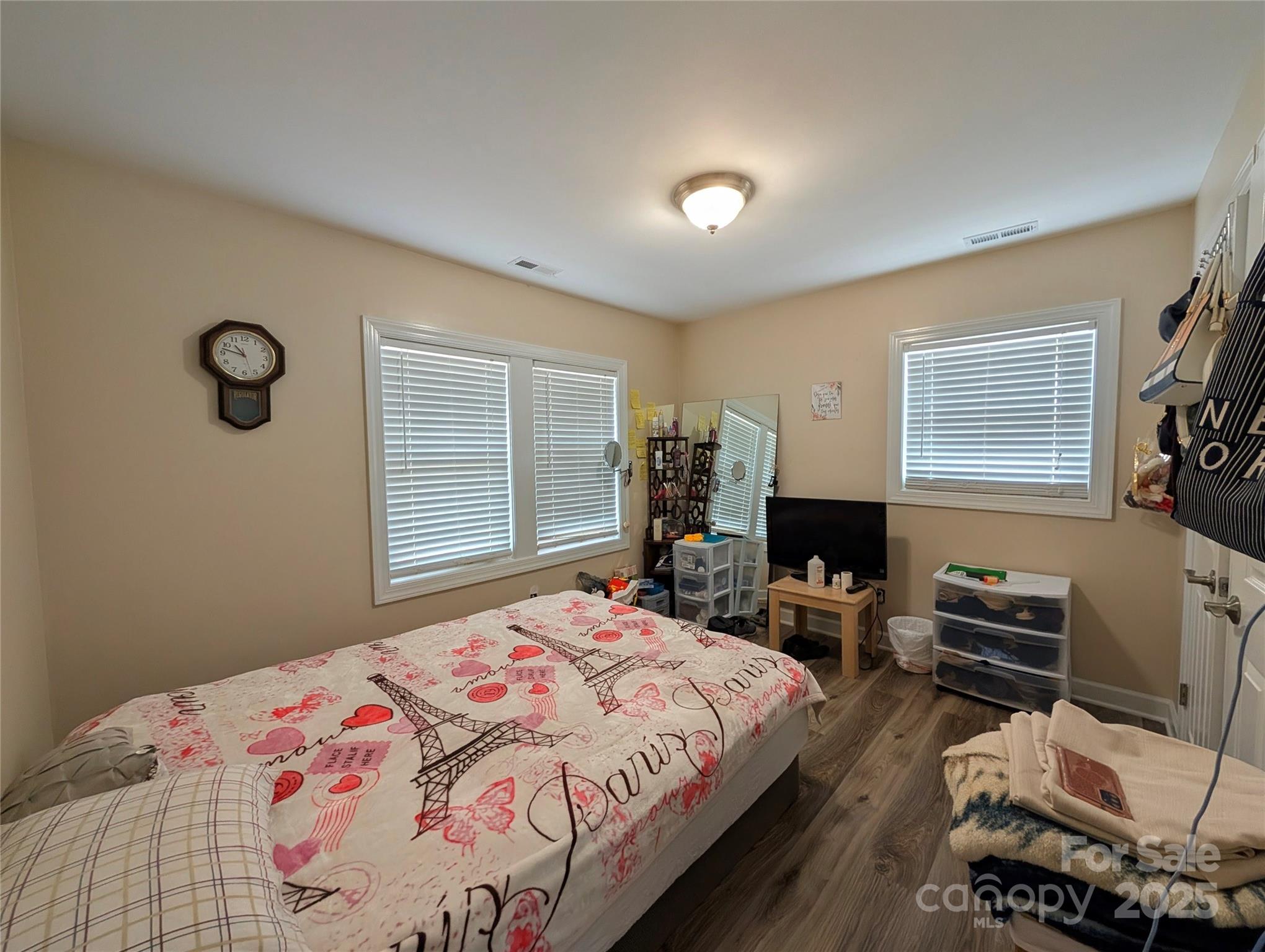 3220 Jonesberry Road Matthews, NC 28105 - Photo 12 of 27 a bedroom with a bed and wooden floor