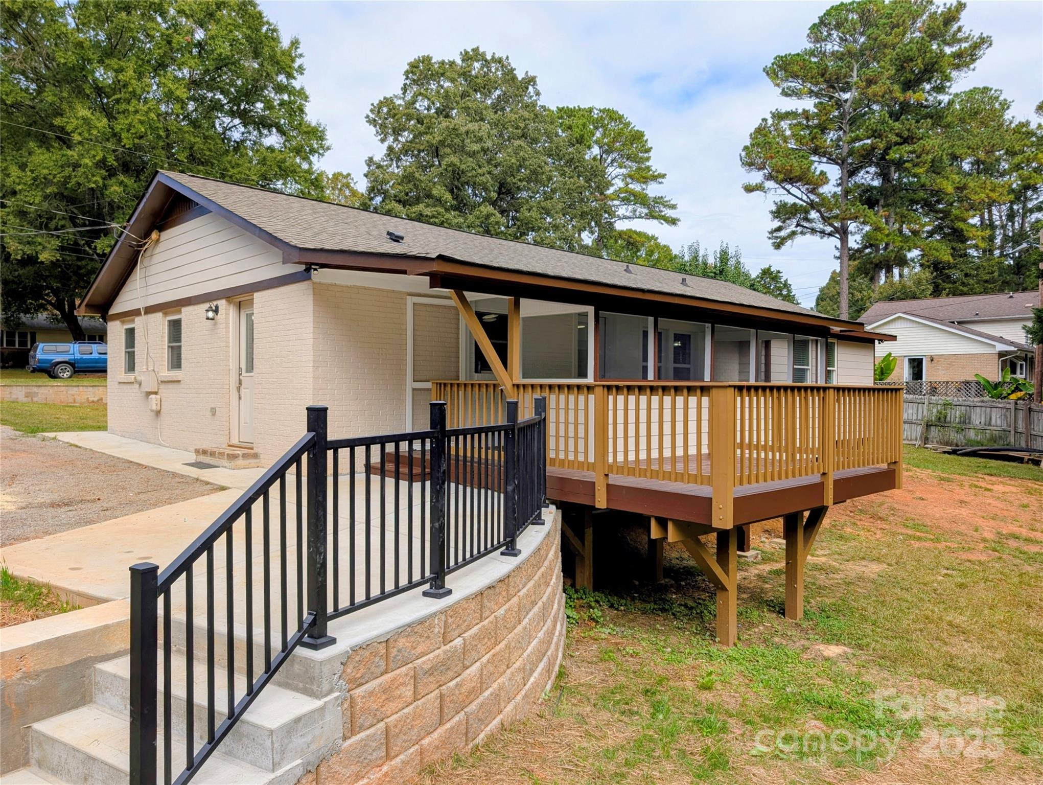3220 Jonesberry Road Matthews, NC 28105 - Photo 18 of 27 a view of a house with wooden deck and furniture