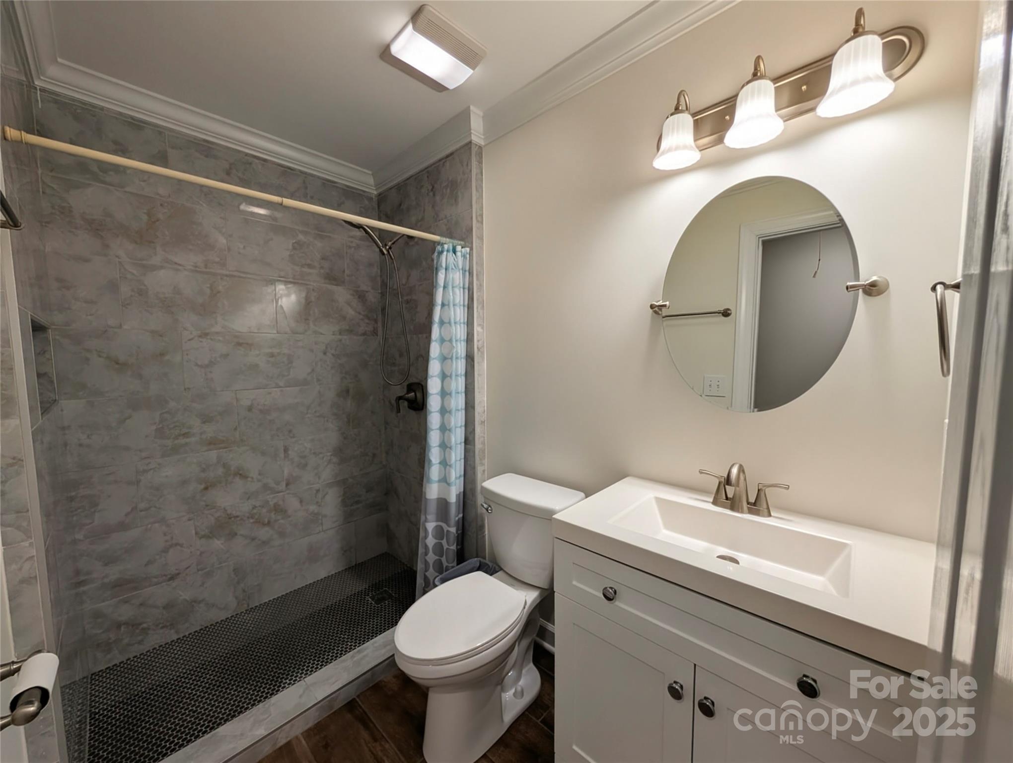 3220 Jonesberry Road Matthews, NC 28105 - Photo 20 of 27 a bathroom with a sink toilet and shower