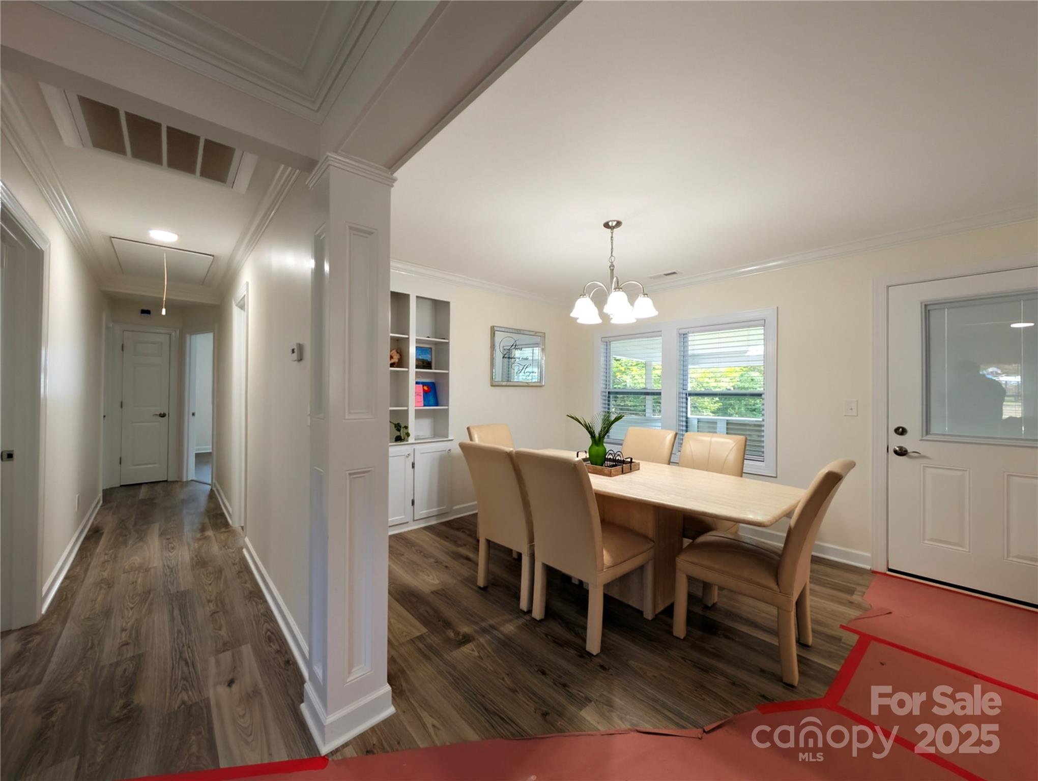 3220 Jonesberry Road Matthews, NC 28105 - Photo 21 of 27 a view of a dining room with furniture and wooden floor