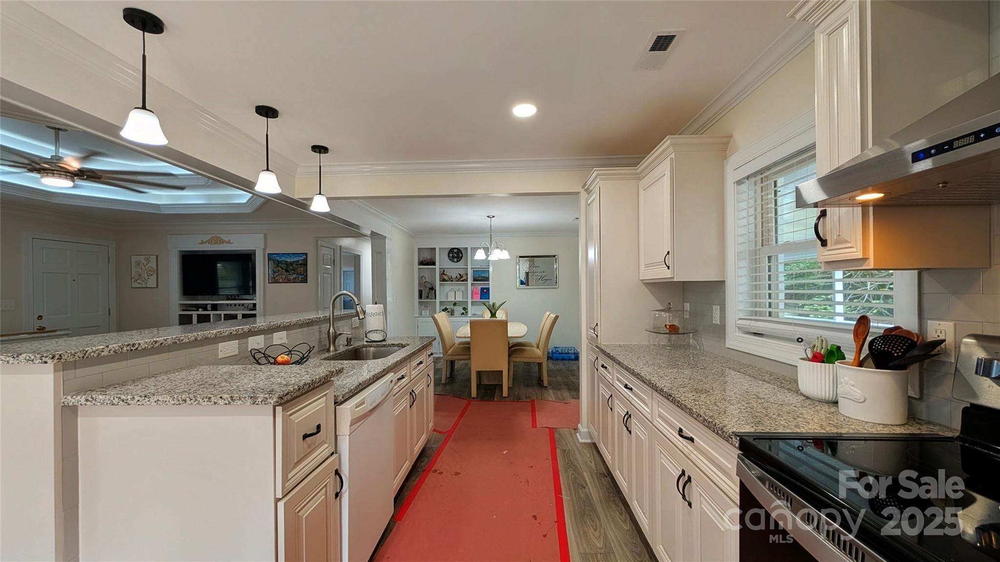 3220 Jonesberry Road Matthews, NC 28105 - Photo 23 of 27 a kitchen with a stove and a sink