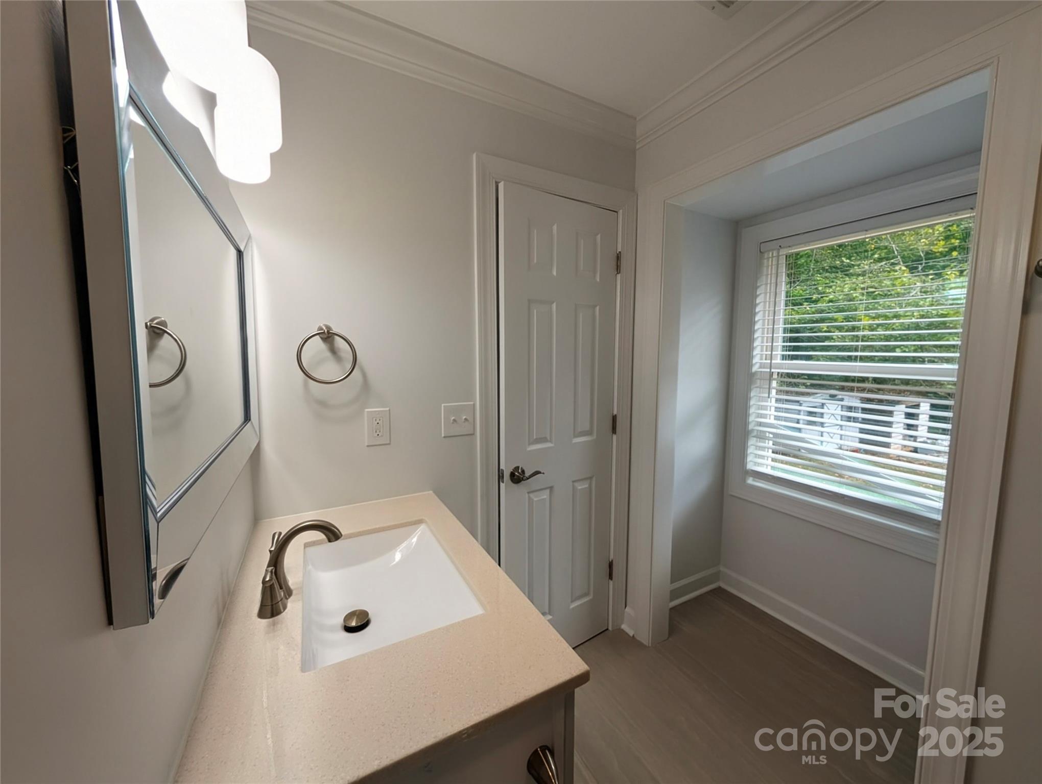3220 Jonesberry Road Matthews, NC 28105 - Photo 5 of 27 a bathroom with a sink and a mirror