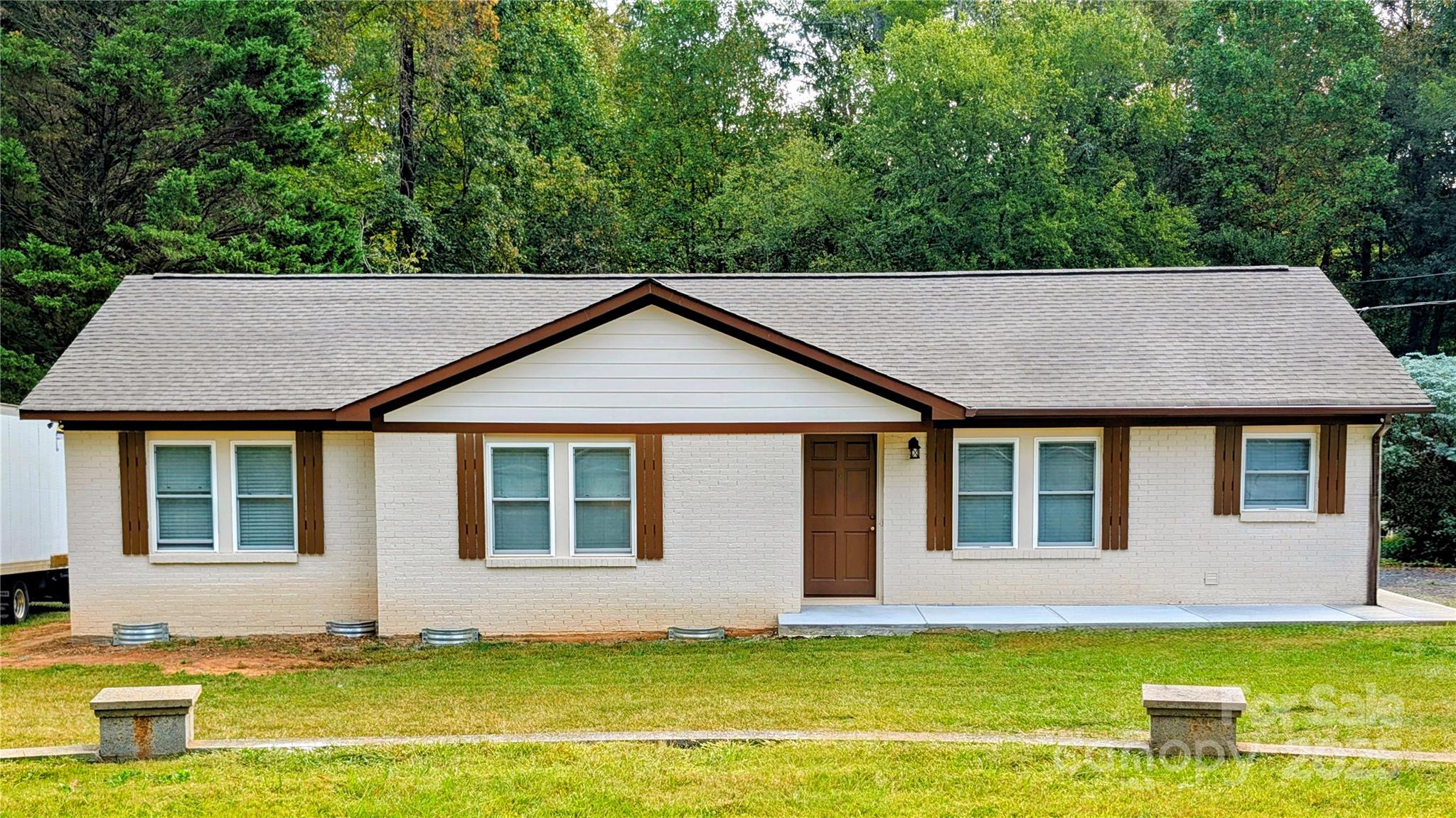 3220 Jonesberry Road Matthews, NC 28105 - Photo 6 of 27 a view of a house with a swimming pool