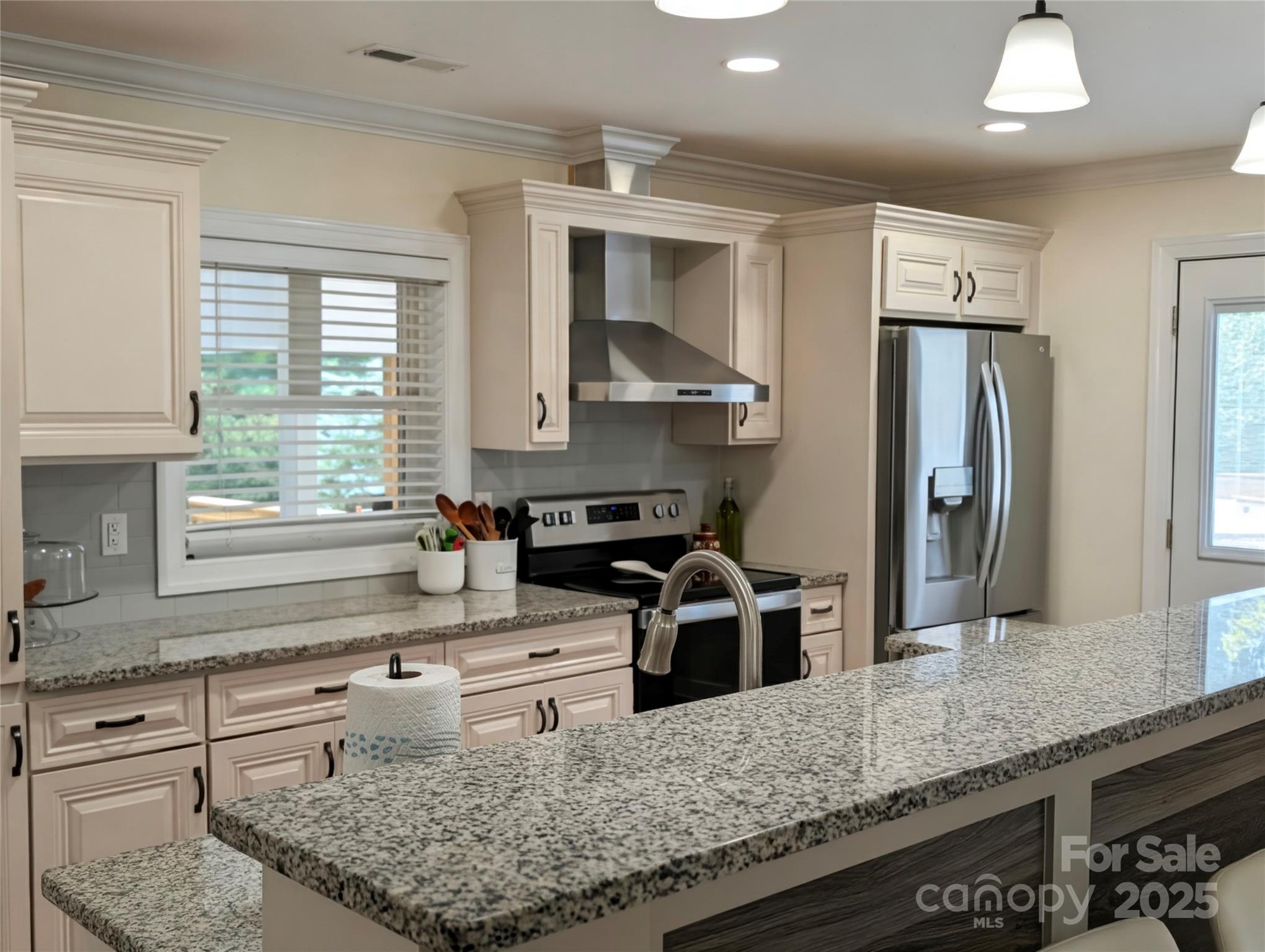 3220 Jonesberry Road Matthews, NC 28105 - Photo 8 of 27 a kitchen with stainless steel appliances granite countertop a sink stove and refrigerator