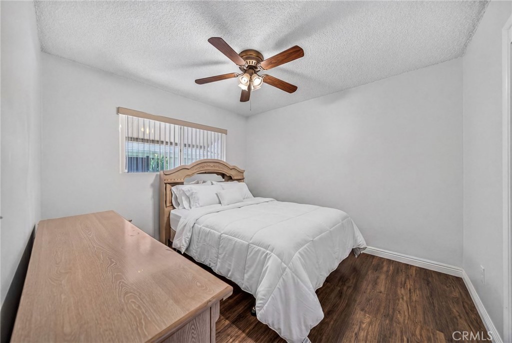 29078 Bradley Road Menifee, CA 92586 - Photo 32 of 42 a bedroom with a bed and window