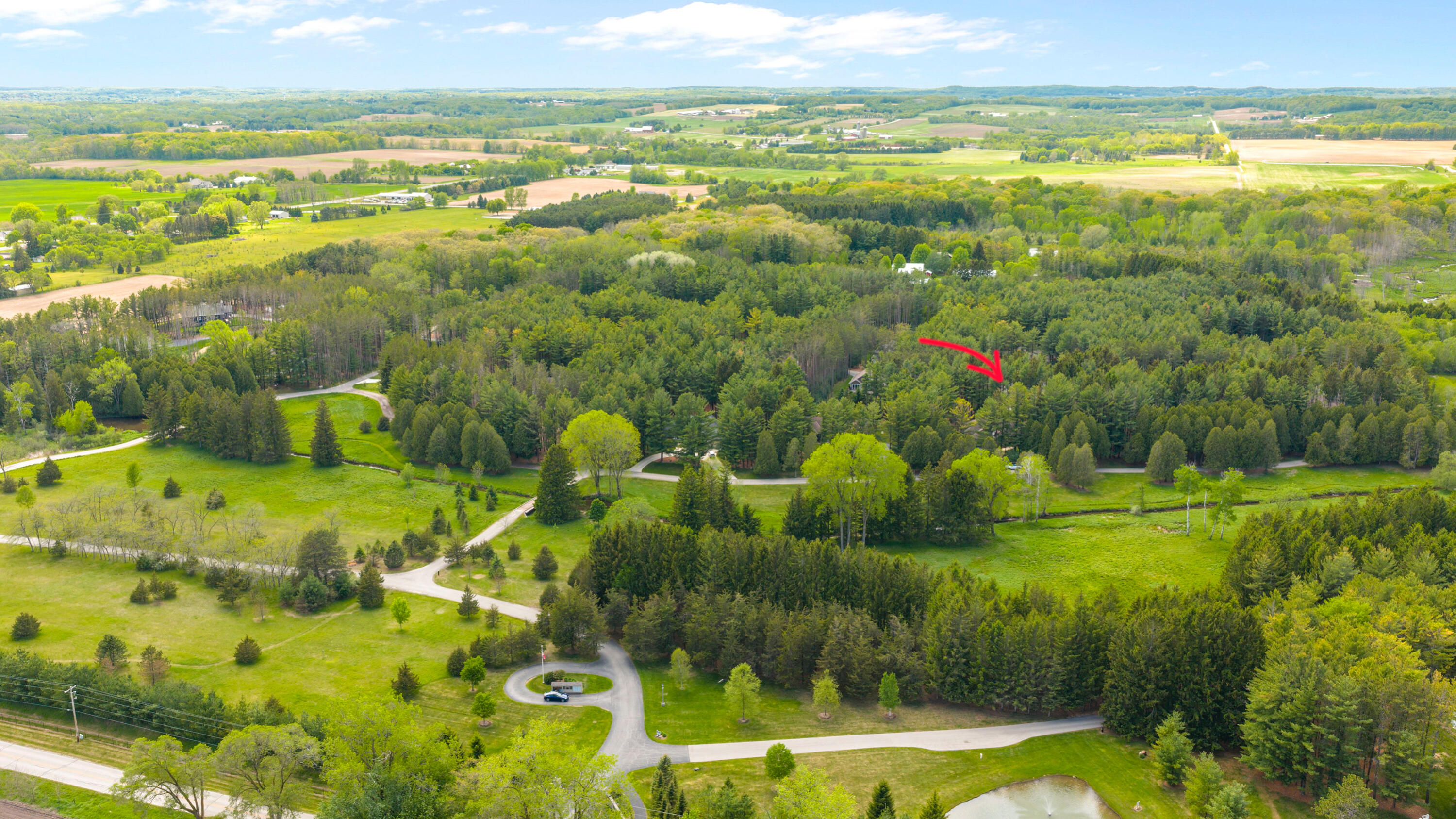 7855 Indian Lore Road, Unit 20 Farmington, WI 53090 - Photo 36 of 38 Drone w_ arrow1