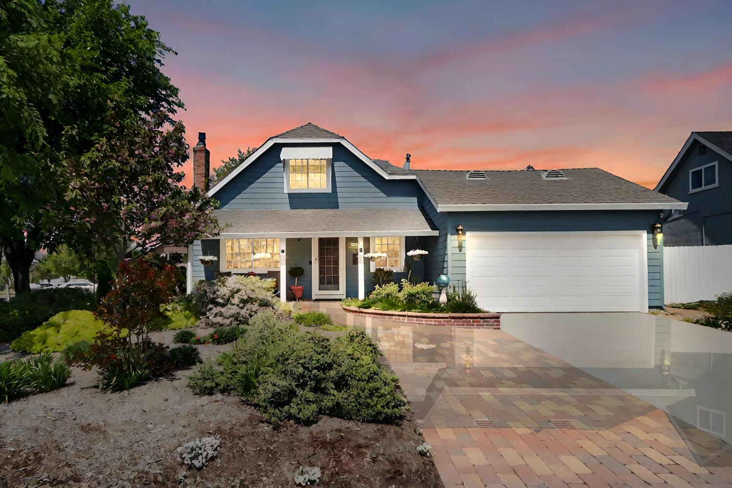 2124 Surrey Road Sacramento, CA 95815 - Photo 1 of 1 a front view of a house with a yard and garage