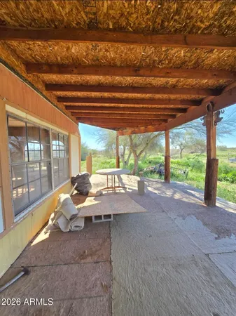 a room with pool table and outdoor seating