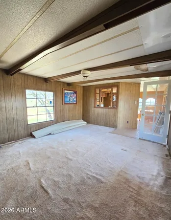 a view of an empty room with windows