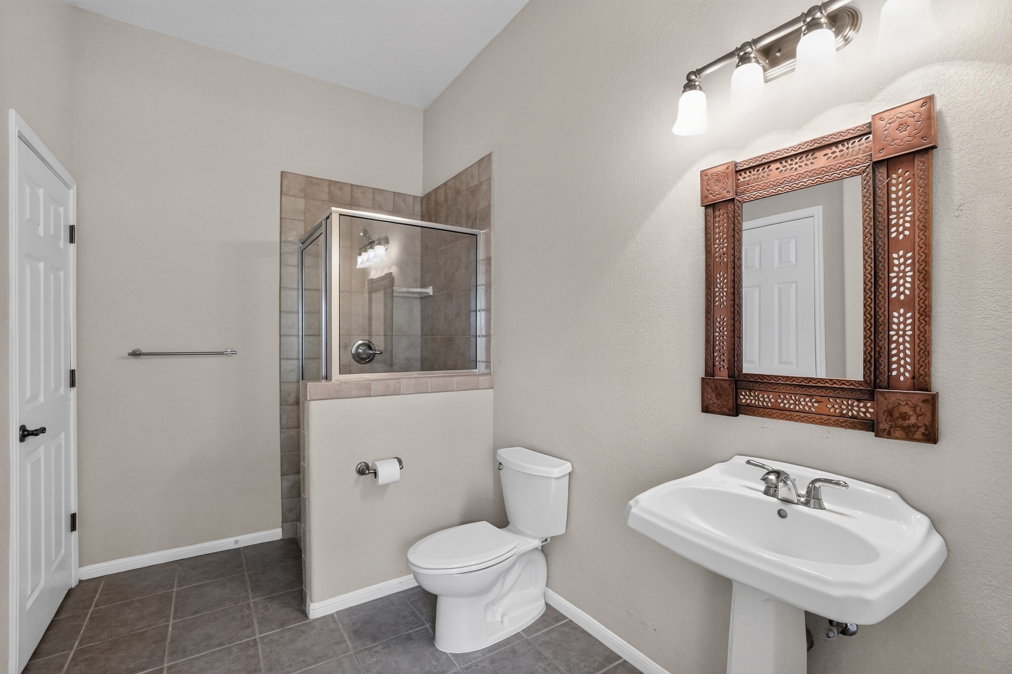 986 High Grove Road Cedar Creek, TX 78612 - Photo 26 of 30 Clean lines and classic tile flooring define this functional three-quarter bathroom.