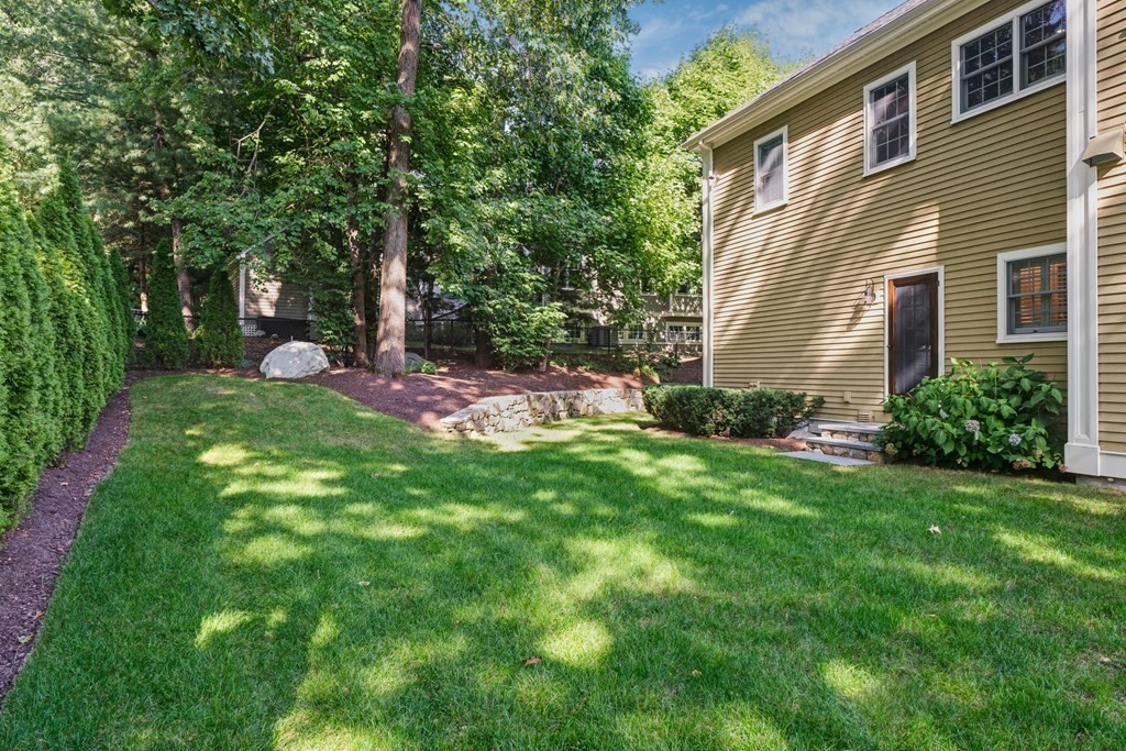 5 Cutler Farm Road Lexington, MA 02421 - Photo 38 of 39 a view of a backyard with plants and large trees