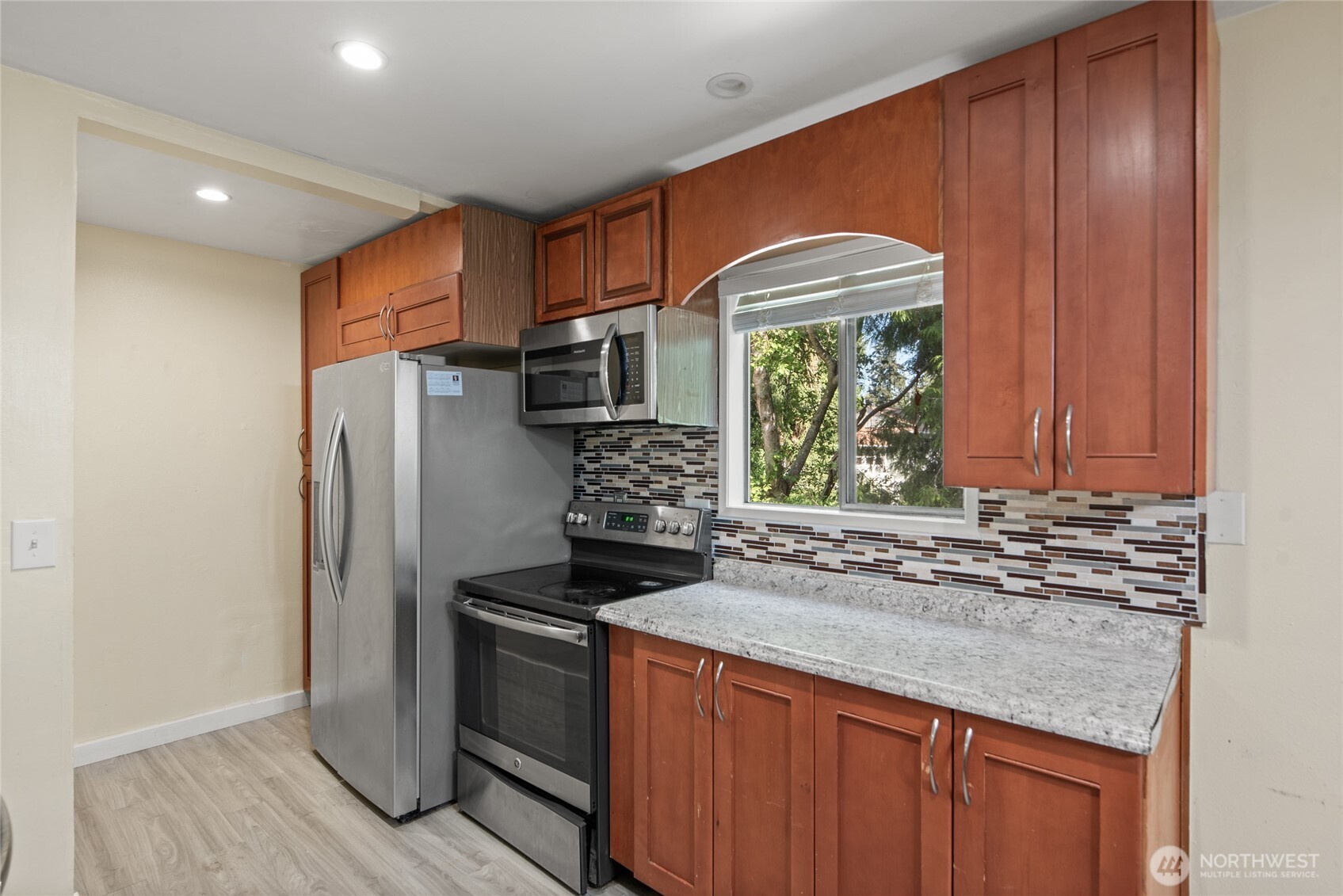 10606 68th Place South Seattle, WA 98178 - Photo 7 of 31 a kitchen with stainless steel appliances granite countertop a refrigerator and a sink
