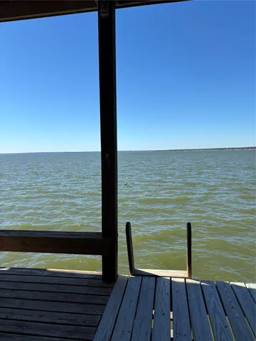 a view of a balcony next to a lake