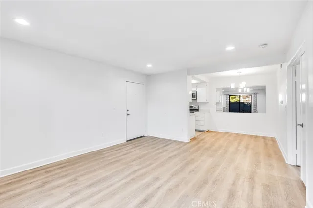 a view of a livingroom with wooden floor