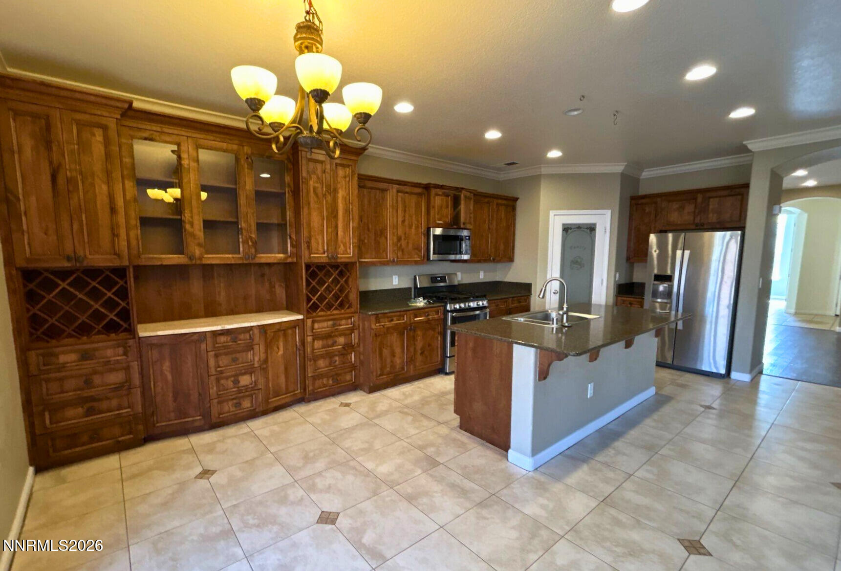 1783 Back Country Road Reno, NV 89521 - Photo 11 of 28 a kitchen with stainless steel appliances granite countertop a refrigerator a stove and a sink