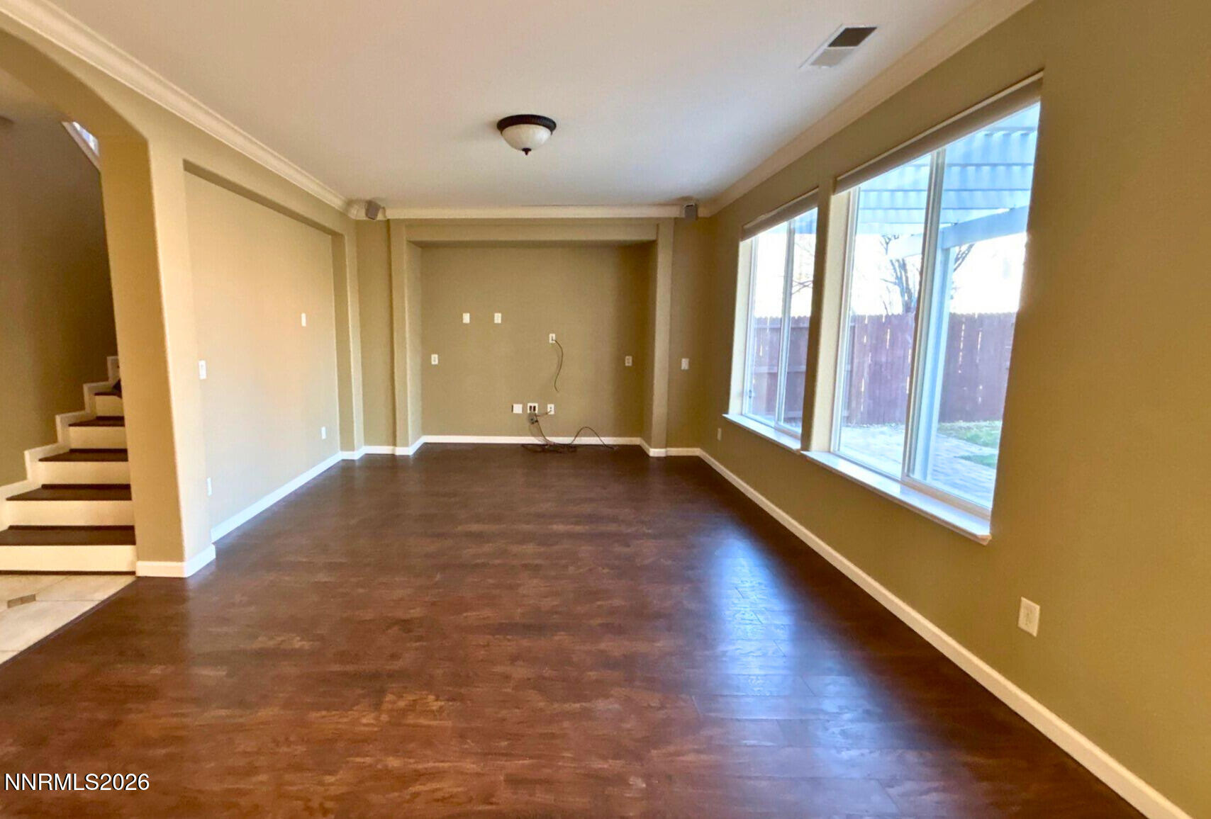 1783 Back Country Road Reno, NV 89521 - Photo 13 of 28 a view of an empty room with wooden floor and a window