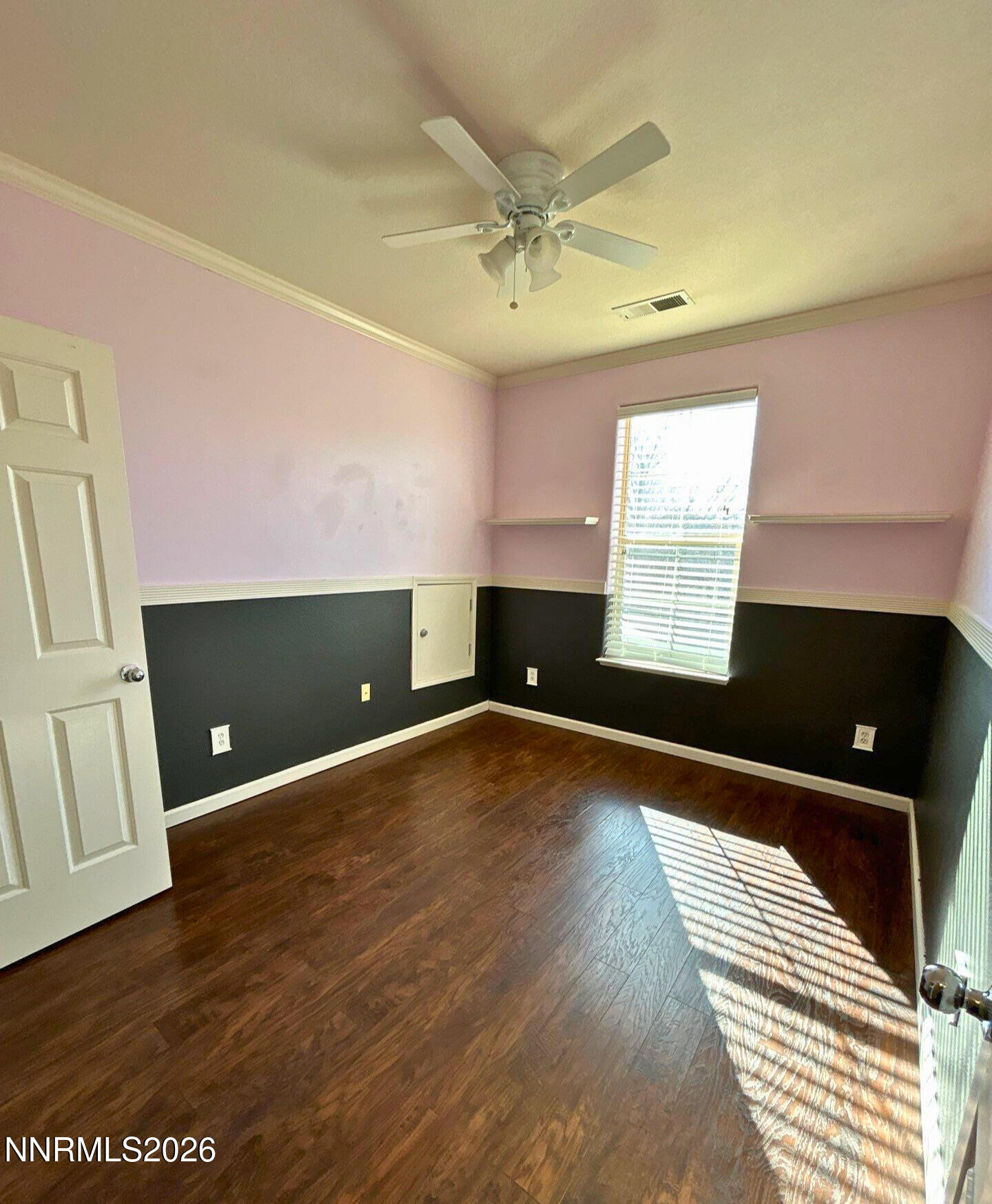 1783 Back Country Road Reno, NV 89521 - Photo 21 of 28 an empty room with wooden floor and windows