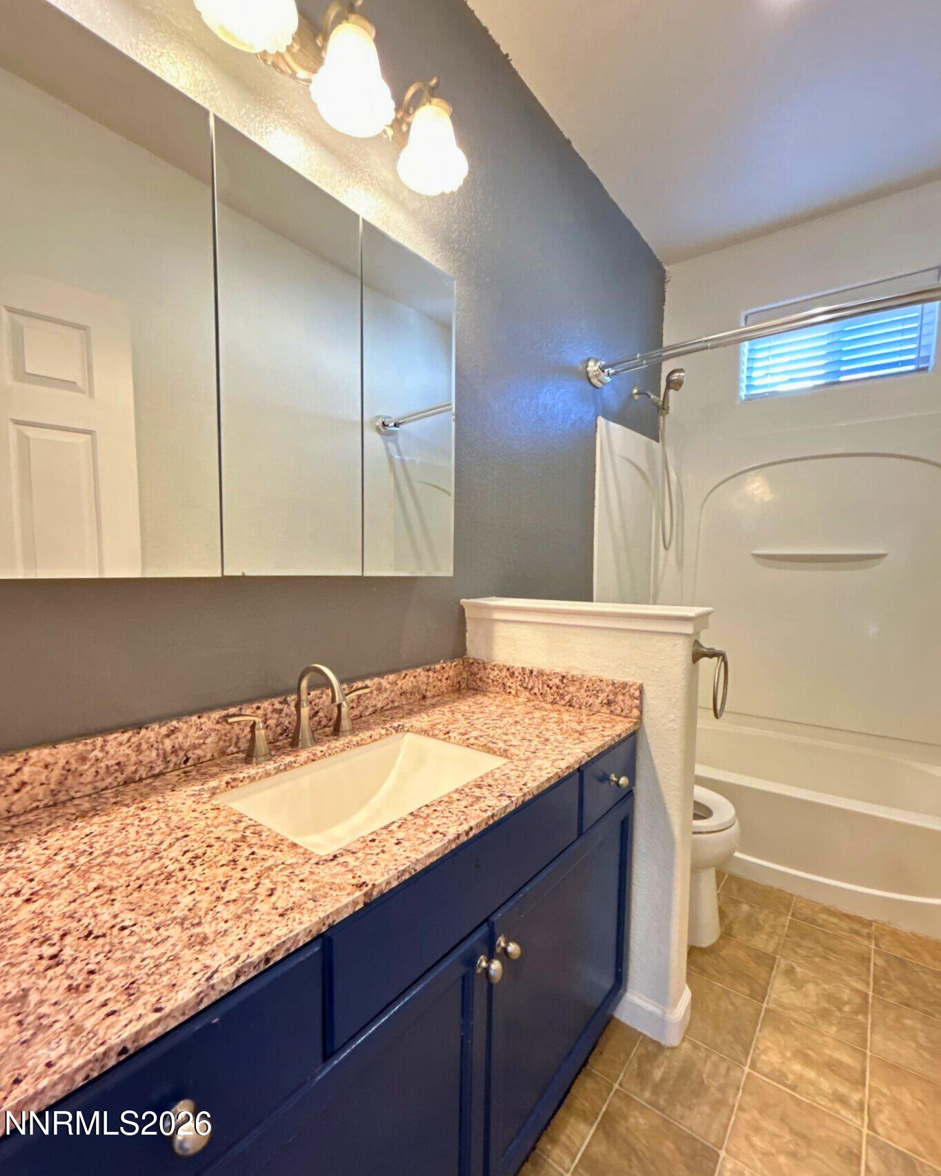1783 Back Country Road Reno, NV 89521 - Photo 22 of 26 a bathroom with a granite countertop sink and a mirror