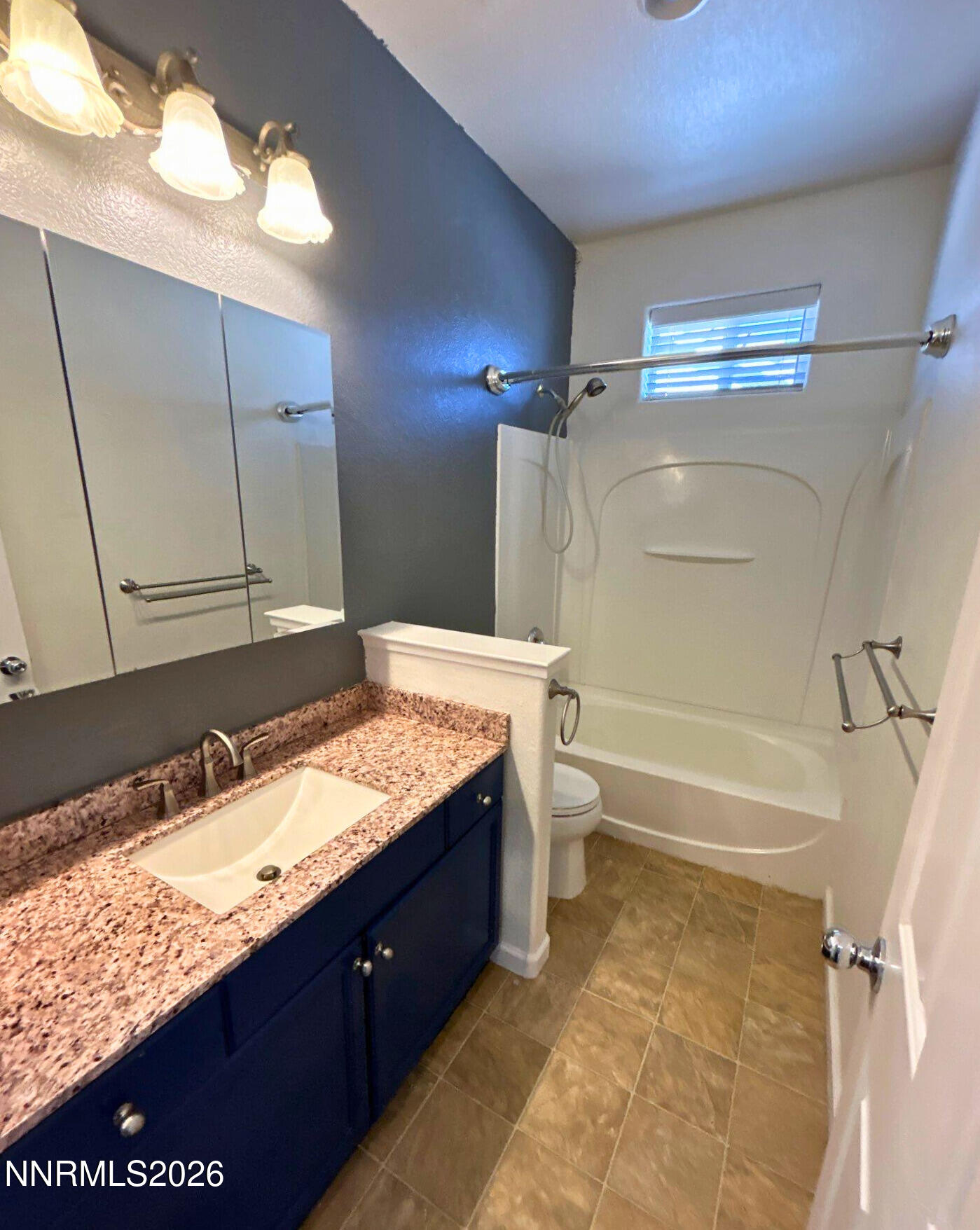 1783 Back Country Road Reno, NV 89521 - Photo 23 of 28 a bathroom with a granite countertop sink toilet and shower