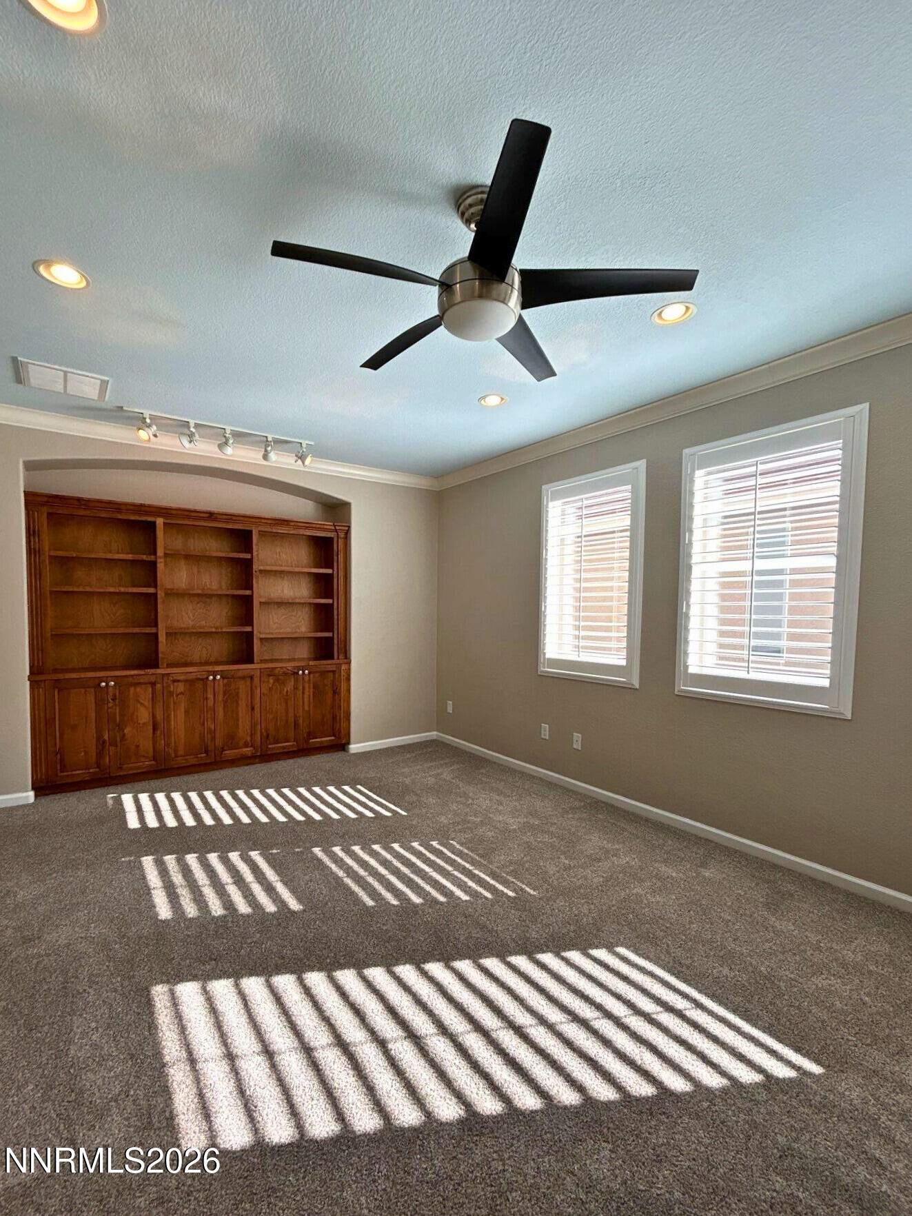 1783 Back Country Road Reno, NV 89521 - Photo 24 of 26 a view of an empty room with a window and a ceiling fan