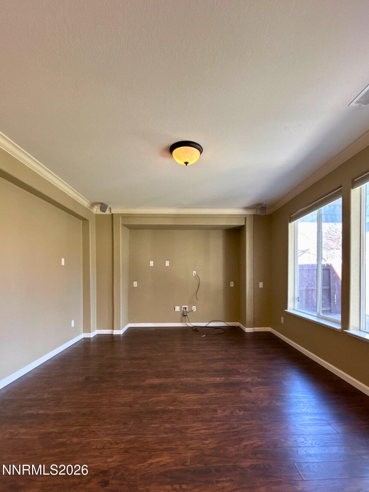 1783 Back Country Road Reno, NV 89521 - Photo 7 of 26 an empty room with wooden floor and windows